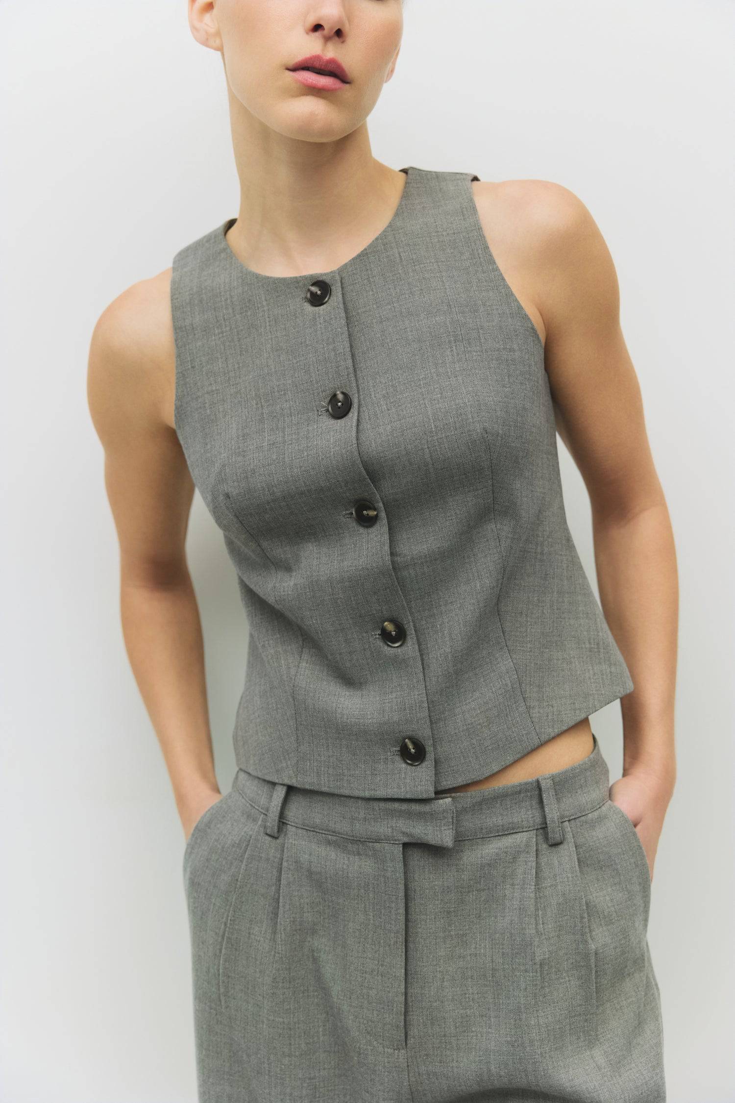 8983722033373, The Andrea Top, Tops, Mod Ref, Black,Bone,Casual,cf-color-bone,cf-size-l,cf-size-m,cf-size-s,cf-size-xl,cf-vendor-all-row,Comfortable,Crew Neckline,Everyday,ivory,Layers,Lightweight,Minimal,new,set,Sets,Sleeveless,Sleeveless Top,Soft,Spring,Top,Trendy,Vest,Vest Top,Women's, Information The Andrea Top is a refined take on the sleeveless vest. Designed with a round neckline, front button closure, and tailored princess seams for a fitted, polished silhouette. Details Self: 75% Polyester, 20% Ray