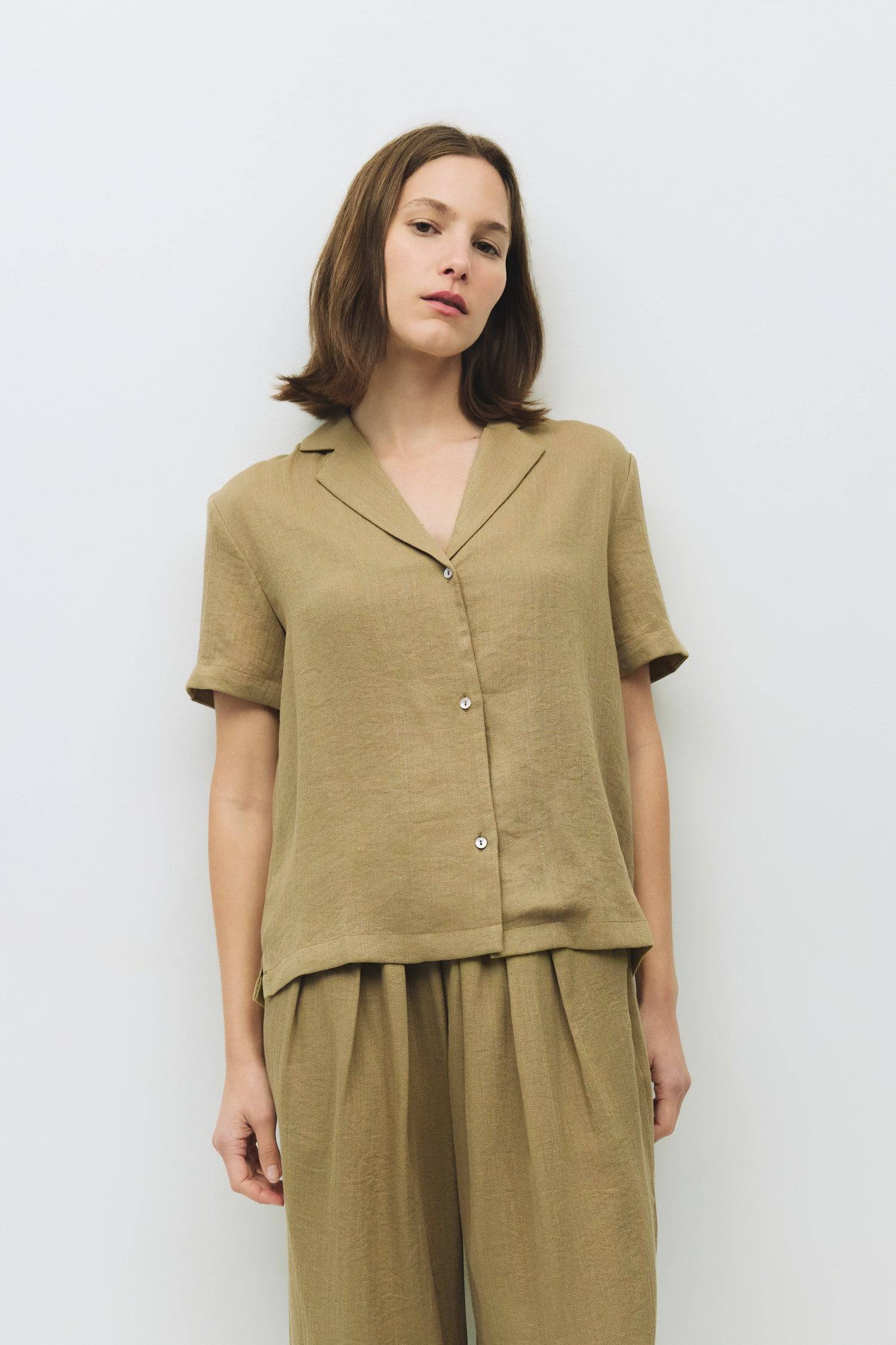 8983723901149, The Donnie Top, Tops, Mod Ref, Black,Breathable,Button down,Button Down Shirt,Button Up,Casual,cf-color-black,cf-color-blue,cf-color-white,cf-size-l,cf-size-m,cf-size-s,cf-vendor-mod-ref,cinched,Cinched Back,Cinched Waist,collared,Collared Top,Cotton,everyday,Long Sleeve,Long Sleeve Top,new,Oversized,spring,Striped,Summer,Tops,Transitional,white,womens,Work,Workwear, Information The Donnie Top is an easygoing take on the classic button-down. With a collared neckline, short sleeves, and a rela