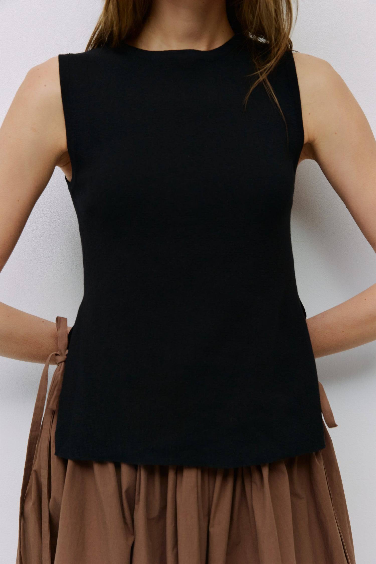 8983738777821, The Amina Top, Tops, Mod Ref, 90s,Basic,Basics,Black,Blue,Casual,cf-color-black,cf-color-blue,cf-color-white,cf-size-l,cf-size-m,cf-size-s,cf-vendor-mod-ref,Comfortable,Crew Neck,Crew Neckline,Everyday,Form Fitting,Ribbed,Ribbed Fabric,Ribbed Top,Short Sleeve,Spring,stretch,Stretchy,Summer,Tee,Tops,Transitional,white,Women's, Information The Amina Top is a sleek, sleeveless knit tank with a fitted silhouette and subtle side slits for ease of movement. Finished with a ribbed neckband and armho