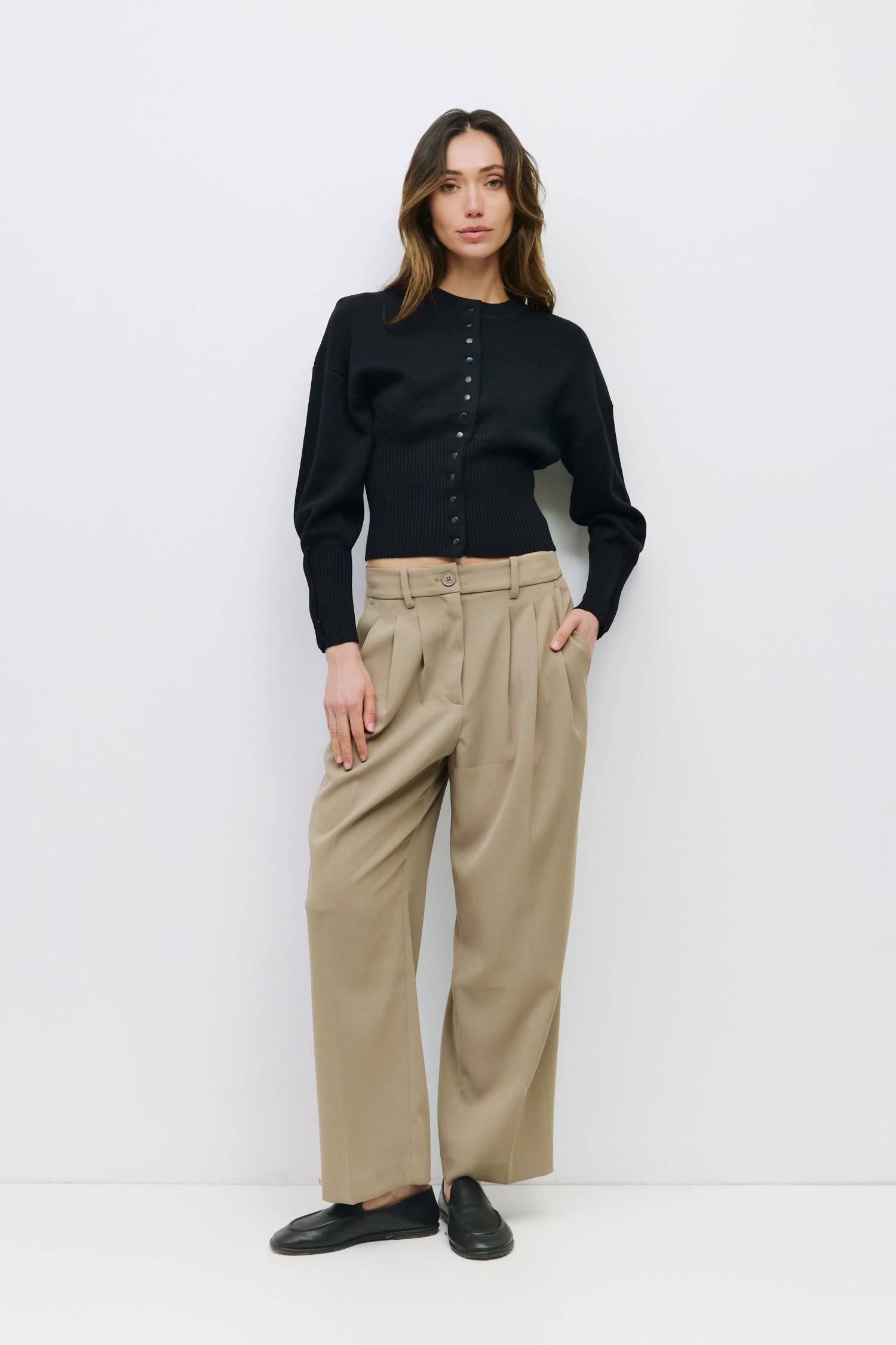 9045597520093, The Rosaline Top, Tops, Mod Ref, Bishop Sleeves,Button Front,cf-color-black,cf-size-m,cf-size-s,cf-size-xl,cf-size-xs,cf-vendor-mod-ref,cinched,Cinched Waist,Comfortable,Everyday,Front Clasp,heavy weight,Knit,Long Sleeve,Mod Ref,modref,new,Rib Knit,ribbd waist,Ribbed,snap closure,Top,Tops,Transitional,Women's,womens top, Information The Rosaline Top is a high-waist sweater top crafted from a heavy knit with a structured silhouette. Designed with a crewneck, bishop sleeves, and ribbing at the