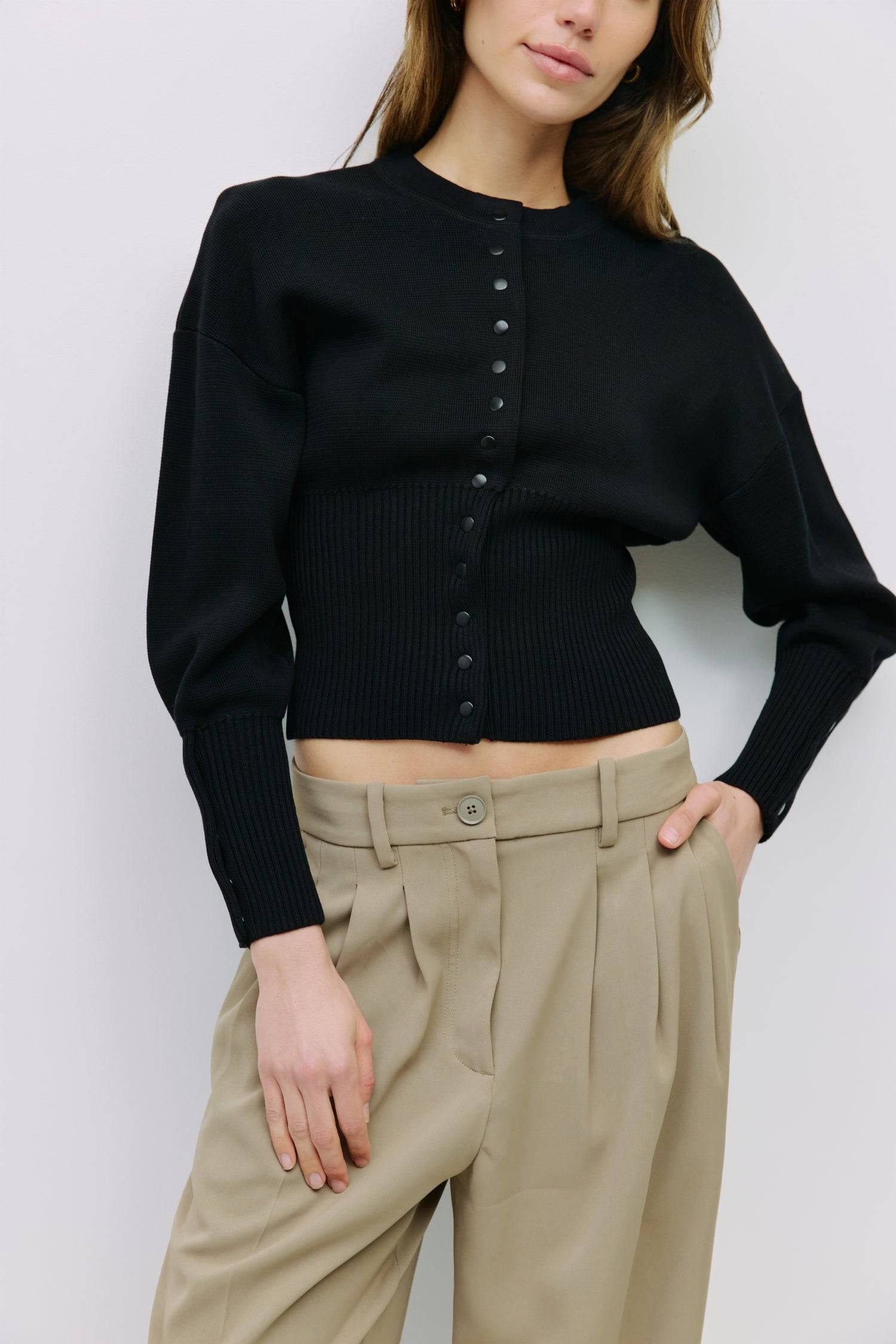 9045597520093, The Rosaline Top, Tops, Mod Ref, Bishop Sleeves,Button Front,cf-color-black,cf-size-m,cf-size-s,cf-size-xl,cf-size-xs,cf-vendor-mod-ref,cinched,Cinched Waist,Comfortable,Everyday,Front Clasp,heavy weight,Knit,Long Sleeve,Mod Ref,modref,new,Rib Knit,ribbd waist,Ribbed,snap closure,Top,Tops,Transitional,Women's,womens top, Information The Rosaline Top is a high-waist sweater top crafted from a heavy knit with a structured silhouette. Designed with a crewneck, bishop sleeves, and ribbing at the