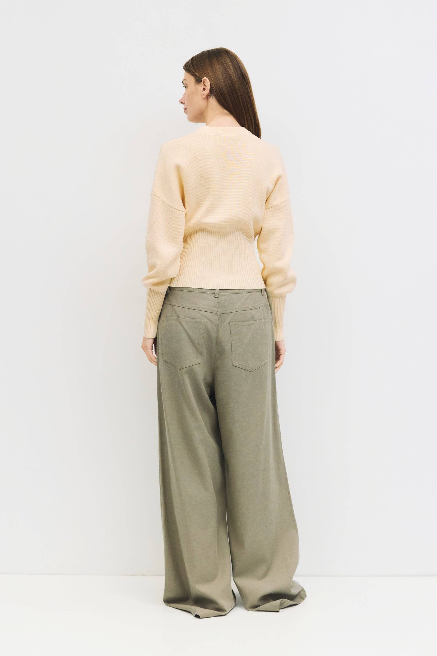 9045597520093, The Rosaline Top, Tops, Mod Ref, Bishop Sleeves,Button Front,cf-color-black,cf-size-m,cf-size-s,cf-size-xl,cf-size-xs,cf-vendor-mod-ref,cinched,Cinched Waist,Comfortable,Everyday,Front Clasp,heavy weight,Knit,Long Sleeve,Mod Ref,modref,new,Rib Knit,ribbd waist,Ribbed,snap closure,Top,Tops,Transitional,Women's,womens top, Information The Rosaline Top is a high-waist sweater top crafted from a heavy knit with a structured silhouette. Designed with a crewneck, bishop sleeves, and ribbing at the