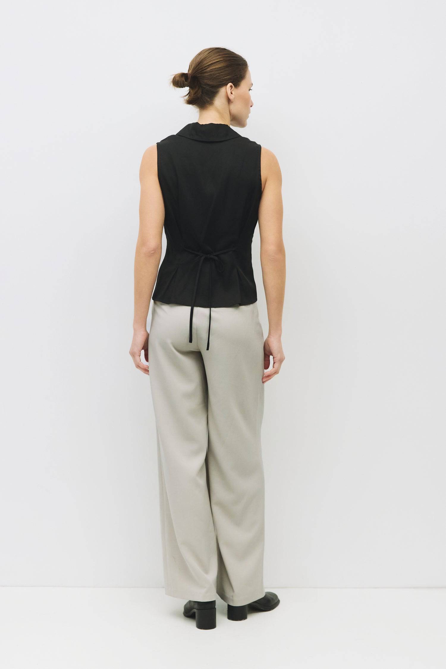 8983728750813, The Olsen Top, Tops, Mod Ref, Black,Breathable,Button down,Button Down Shirt,Button Up,Casual,cf-color-black,cf-color-blue,cf-color-white,cf-size-l,cf-size-m,cf-size-s,cf-vendor-mod-ref,cinched,Cinched Back,Cinched Waist,collared,Collared Top,Cotton,everyday,final-sale,finalsale,Long Sleeve,Long Sleeve Top,new,Oversized,sale,spring,Striped,Summer,Tops,Transitional,white,womens,Work,Workwear, Information The Olsen Top is a sleeveless button-down with a V neckline and front placket closure. Fea