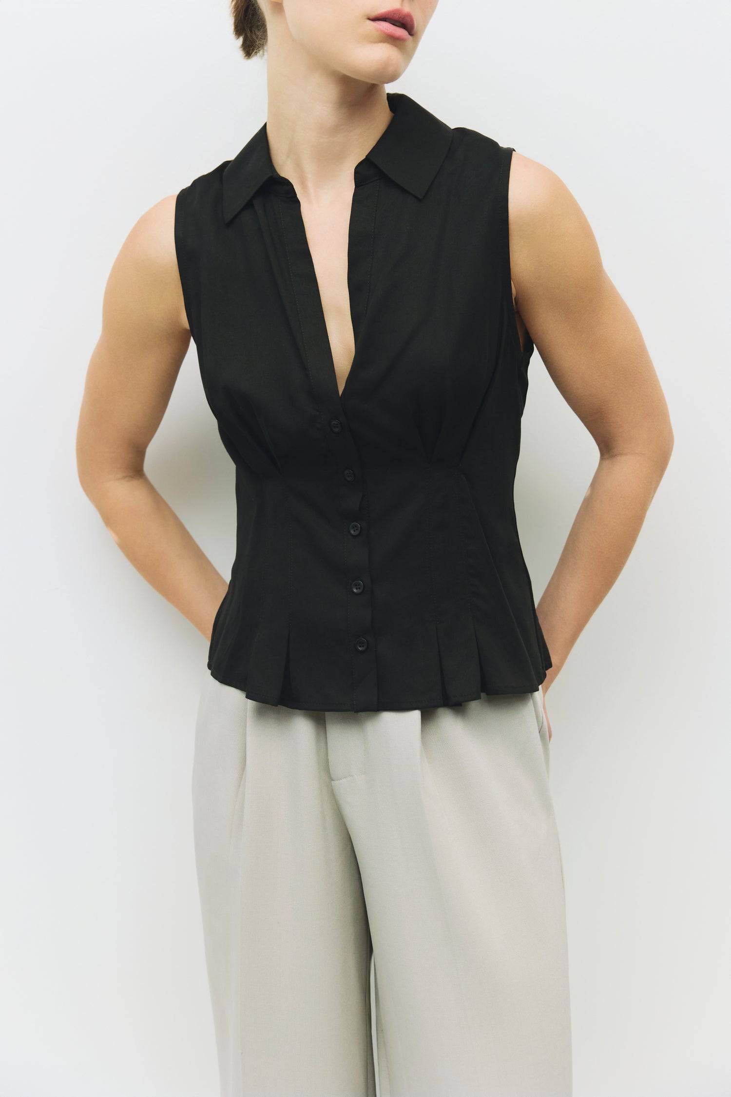 8983728750813, The Olsen Top, Tops, Mod Ref, Black,Breathable,Button down,Button Down Shirt,Button Up,Casual,cf-color-black,cf-color-blue,cf-color-white,cf-size-l,cf-size-m,cf-size-s,cf-vendor-mod-ref,cinched,Cinched Back,Cinched Waist,collared,Collared Top,Cotton,everyday,final-sale,finalsale,Long Sleeve,Long Sleeve Top,new,Oversized,sale,spring,Striped,Summer,Tops,Transitional,white,womens,Work,Workwear, Information The Olsen Top is a sleeveless button-down with a V neckline and front placket closure. Fea