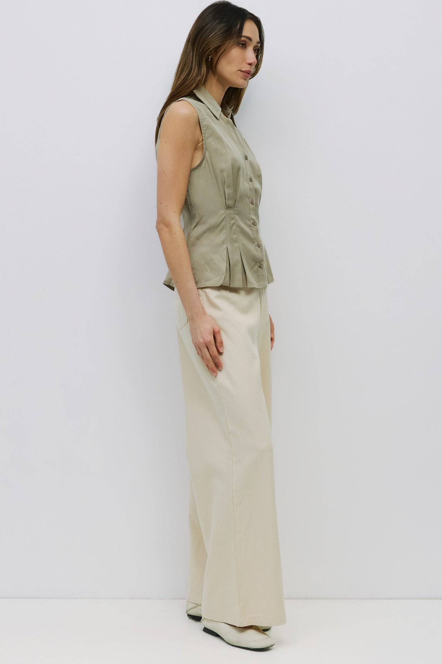 8983728750813, The Olsen Top, Tops, Mod Ref, Black,Breathable,Button down,Button Down Shirt,Button Up,Casual,cf-color-black,cf-color-blue,cf-color-white,cf-size-l,cf-size-m,cf-size-s,cf-vendor-mod-ref,cinched,Cinched Back,Cinched Waist,collared,Collared Top,Cotton,everyday,final-sale,finalsale,Long Sleeve,Long Sleeve Top,new,Oversized,sale,spring,Striped,Summer,Tops,Transitional,white,womens,Work,Workwear, Information The Olsen Top is a sleeveless button-down with a V neckline and front placket closure. Fea