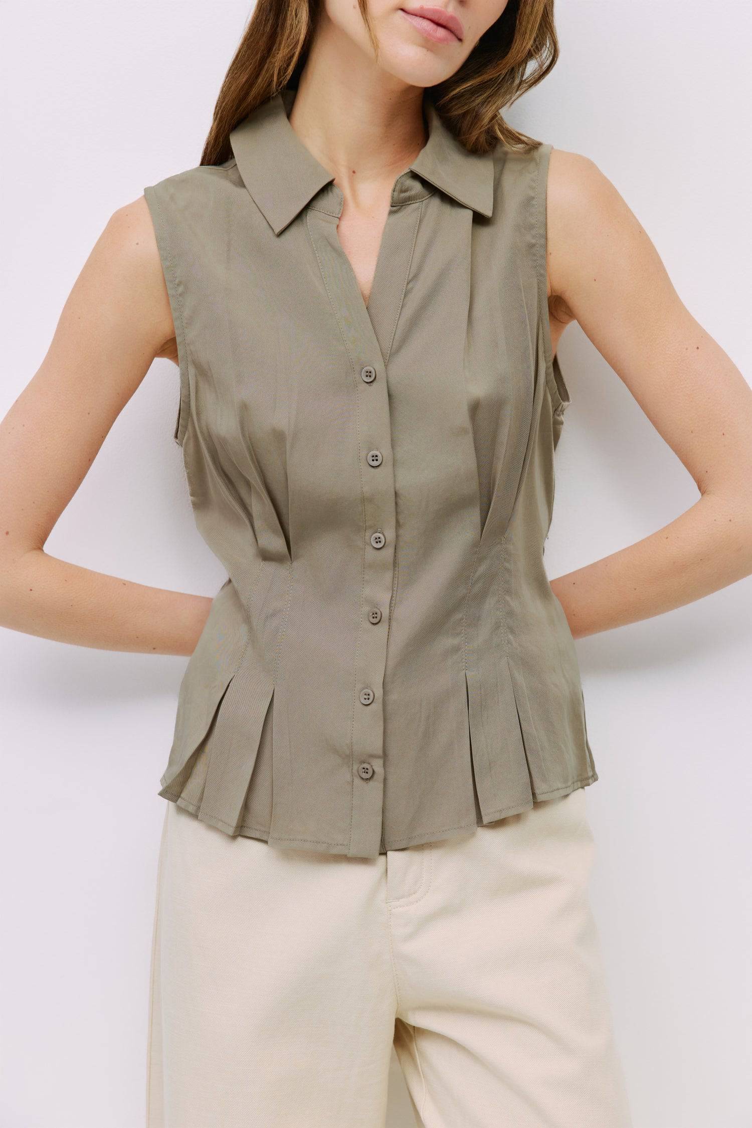 8983728750813, The Olsen Top, Tops, Mod Ref, Black,Breathable,Button down,Button Down Shirt,Button Up,Casual,cf-color-black,cf-color-blue,cf-color-white,cf-size-l,cf-size-m,cf-size-s,cf-vendor-mod-ref,cinched,Cinched Back,Cinched Waist,collared,Collared Top,Cotton,everyday,final-sale,finalsale,Long Sleeve,Long Sleeve Top,new,Oversized,sale,spring,Striped,Summer,Tops,Transitional,white,womens,Work,Workwear, Information The Olsen Top is a sleeveless button-down with a V neckline and front placket closure. Fea