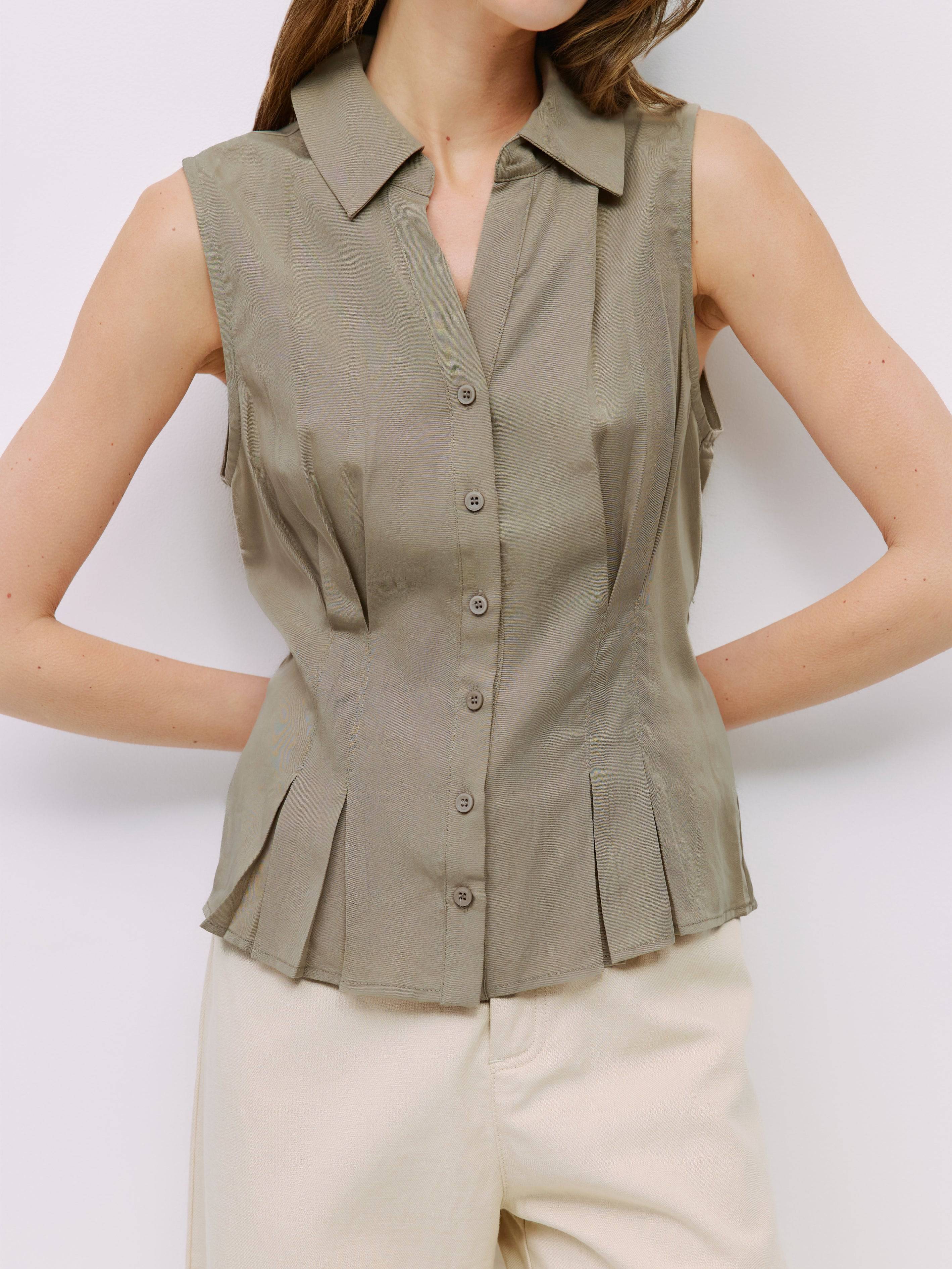 8983728750813, The Olsen Top, Tops, Mod Ref, Black,Breathable,Button down,Button Down Shirt,Button Up,Casual,cf-color-black,cf-color-blue,cf-color-white,cf-size-l,cf-size-m,cf-size-s,cf-vendor-mod-ref,cinched,Cinched Back,Cinched Waist,collared,Collared Top,Cotton,everyday,final-sale,finalsale,Long Sleeve,Long Sleeve Top,new,Oversized,sale,spring,Striped,Summer,Tops,Transitional,white,womens,Work,Workwear, Information The Olsen Top is a sleeveless button-down with a V neckline and front placket closure. Fea