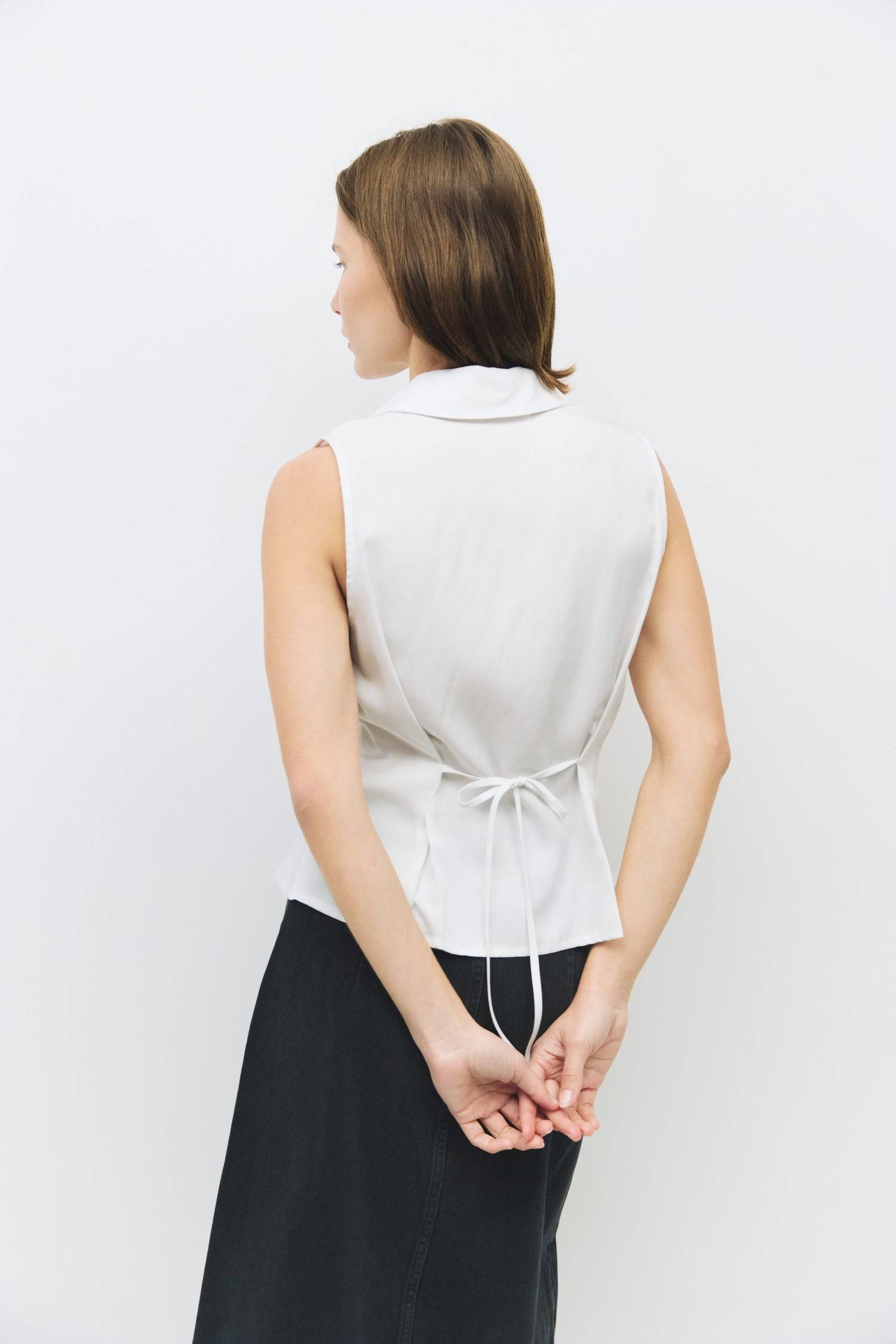 8983728750813, The Olsen Top, Tops, Mod Ref, Black,Breathable,Button down,Button Down Shirt,Button Up,Casual,cf-color-black,cf-color-blue,cf-color-white,cf-size-l,cf-size-m,cf-size-s,cf-vendor-mod-ref,cinched,Cinched Back,Cinched Waist,collared,Collared Top,Cotton,everyday,final-sale,finalsale,Long Sleeve,Long Sleeve Top,new,Oversized,sale,spring,Striped,Summer,Tops,Transitional,white,womens,Work,Workwear, Information The Olsen Top is a sleeveless button-down with a V neckline and front placket closure. Fea