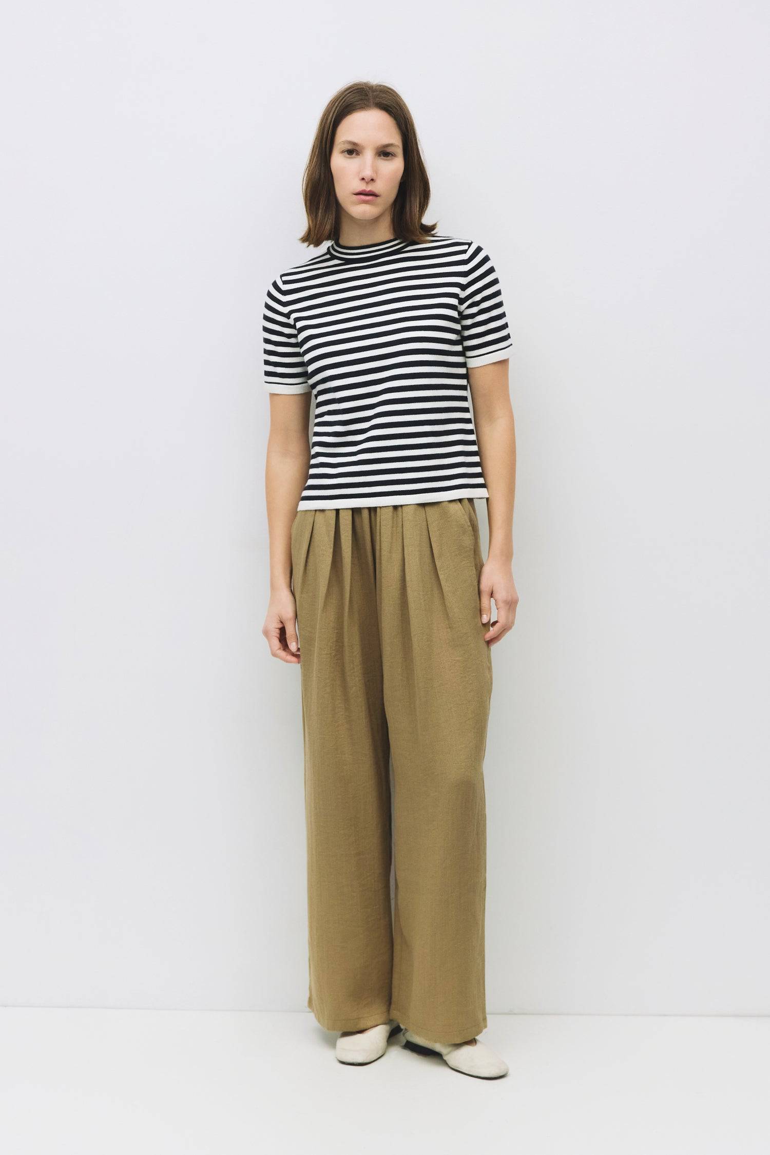 9045577728221, The Clarissa Top, Tops, Mod Ref, Basic,Basics,Black,Casual,cf-color-black,cf-size-l,cf-size-m,cf-size-s,cf-vendor-mod-ref,Comfortable,Crew Neck,Crew Neckline,Everyday,Knit,Knit Top,mid weight,Mock neck,new,Short Sleeve,Spring,Striped,Stripes,Summer,Tee,Tops,Transitional,Vertical Stripes,white,Women's,womens top, Information The Clarissa Top is a striped knit with a sleek mock neck and short sleeves, offering a timeless, structured look. Made from midweight knit, it’s finished with ribbed band