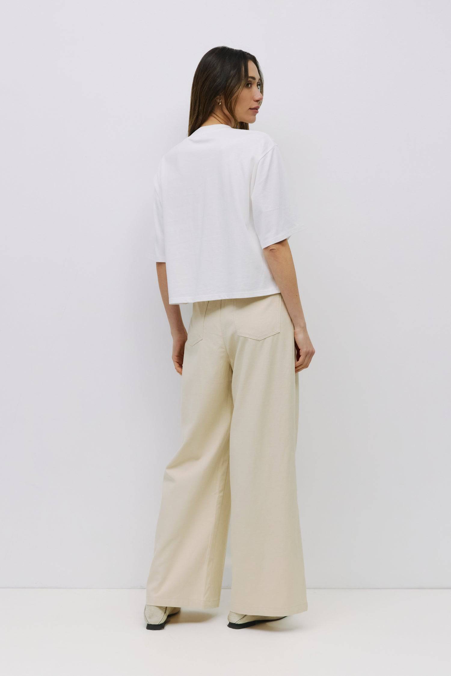 8993035223261, The Daphne Top, Tops, Mod Ref, Basic,Basics,Black,Blue,Casual,cf-color-black,cf-color-blue,cf-color-white,cf-size-l,cf-size-m,cf-size-s,cf-vendor-mod-ref,Comfortable,Crew Neck,Crew Neckline,Everyday,Short Sleeve,Spring,Summer,Tee,Tops,Transitional,white,Women's, Information The Daphne Top is a relaxed crewneck tee made from a midweight cotton jersey for a soft, breathable feel. The elbow-length sleeves and side slit accent give it a laid-back, modern twist. Details Self: 100% Cotton Contrast: