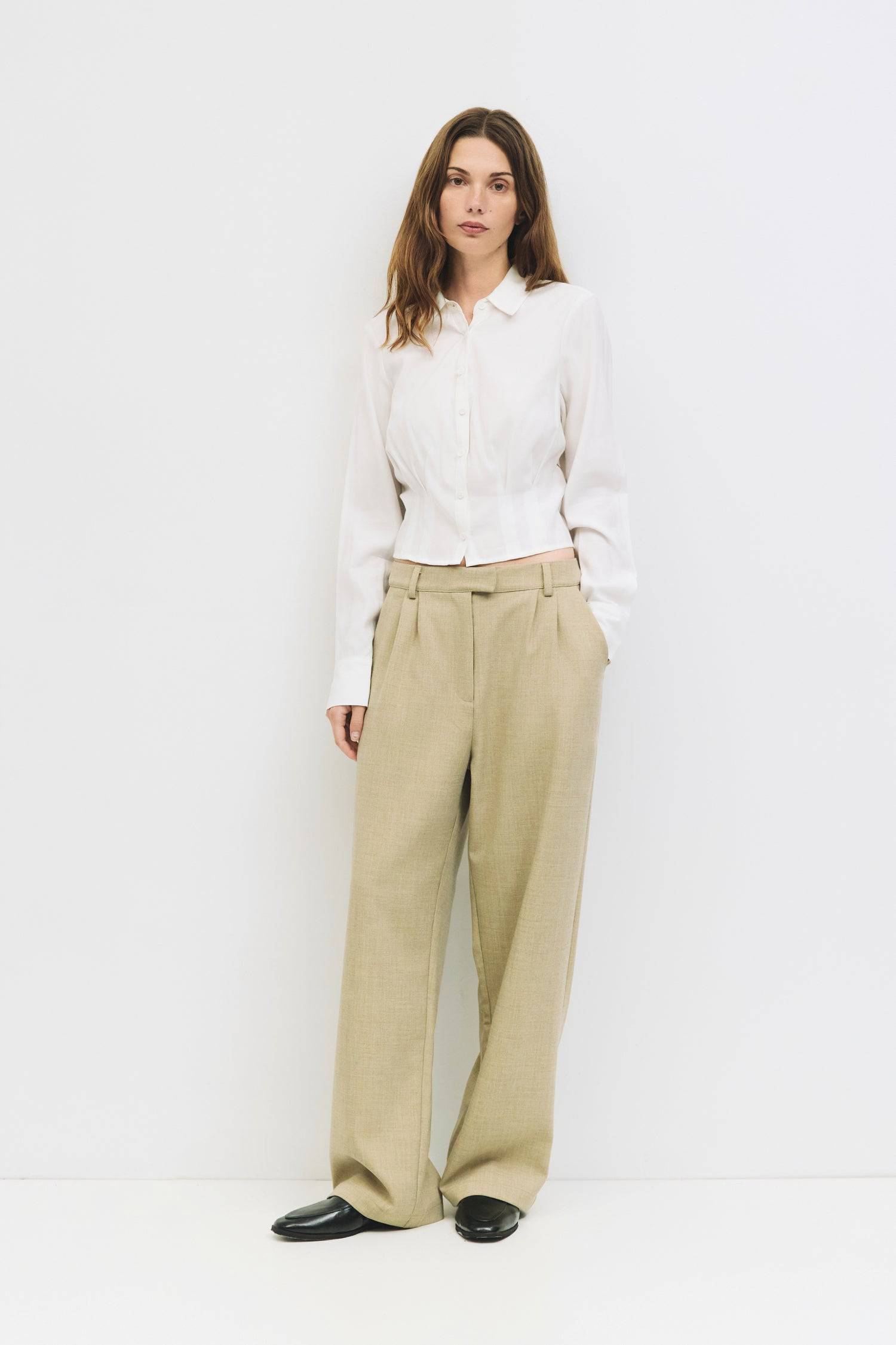 9084452274397, The Violeta Top, Tops, Mod Ref, Blouse,Breathable,Button down,Button Down Shirt,Button Up,Casual,cf-color-grey,cf-color-white,cf-size-l,cf-size-m,cf-size-s,cf-vendor-mod-ref,cinched,Cinched Back,Cinched Waist,collared,Collared Top,Cropped,cropped hemline,everyday,Grey,Long Sleeve,Long Sleeve Top,new,Pleated,Silk,Silky,slim fit,spring,Tapered,Tops,white,womens,Work,Workwear, Information The Violeta Top is a slim-fit button-down blouse with a collared neckline and long sleeves. It features a ta