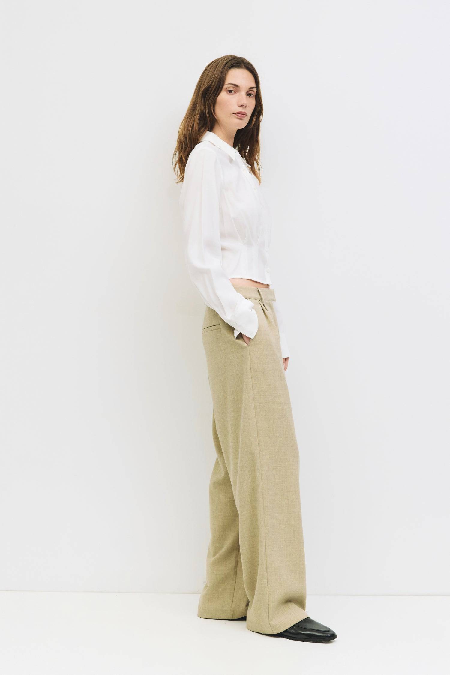 9084452274397, The Violeta Top, Tops, Mod Ref, Blouse,Breathable,Button down,Button Down Shirt,Button Up,Casual,cf-color-grey,cf-color-white,cf-size-l,cf-size-m,cf-size-s,cf-vendor-mod-ref,cinched,Cinched Back,Cinched Waist,collared,Collared Top,Cropped,cropped hemline,everyday,Grey,Long Sleeve,Long Sleeve Top,new,Pleated,Silk,Silky,slim fit,spring,Tapered,Tops,white,womens,Work,Workwear, Information The Violeta Top is a slim-fit button-down blouse with a collared neckline and long sleeves. It features a ta