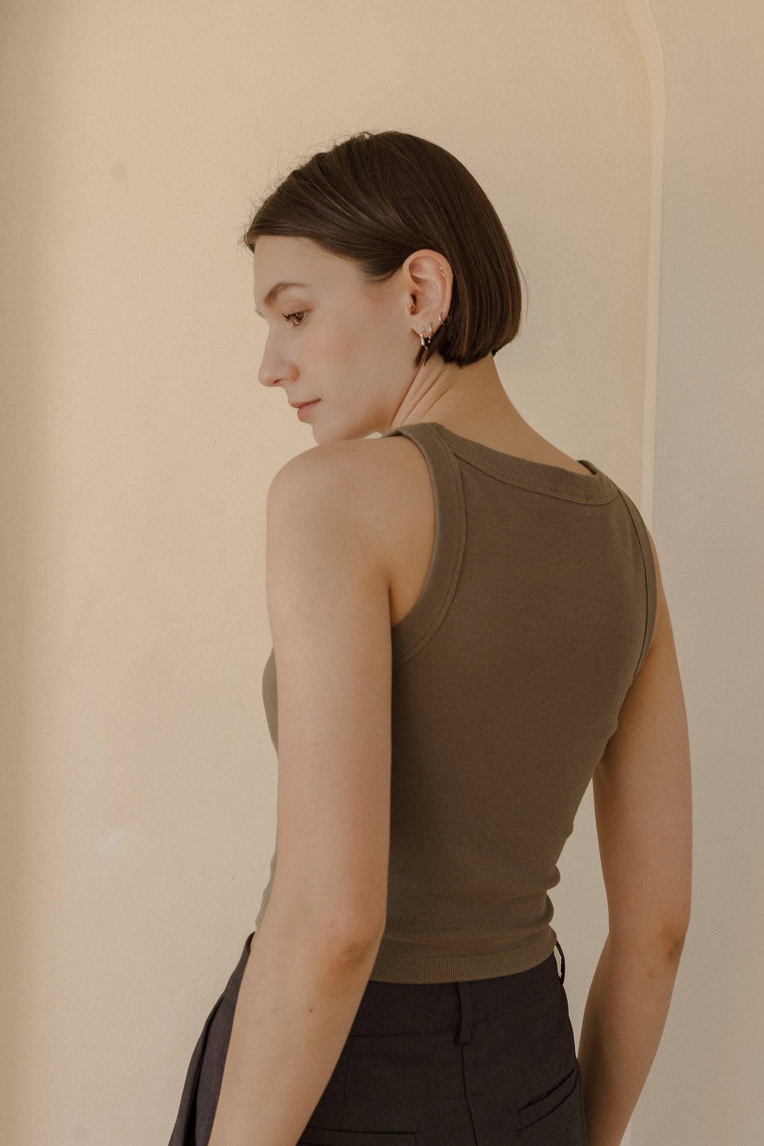 8169757147357, The Tonya Top, Tops, Mod Ref, Basic,Basics,Blush,cf-color-black,cf-color-blush,cf-color-olive,cf-size-l,cf-size-m,cf-size-s,cf-vendor-mod-ref,Cotton,Crop,Crop Top,Cropped,essentials,Everyday,final-sale,finalsale,layering,Layers,Olive,racerback,Rib,Ribbed,Ribbed Fabric,Ribbed Top,Ribbing,sale,tank,Tank Top, Information The Tonya Top is a basic cropped ribbed tank top. Crafted from a rayon-cotton-spandex blend, this racerback tank top is a versatile piece for your daily wardrobe. Perfect for pa