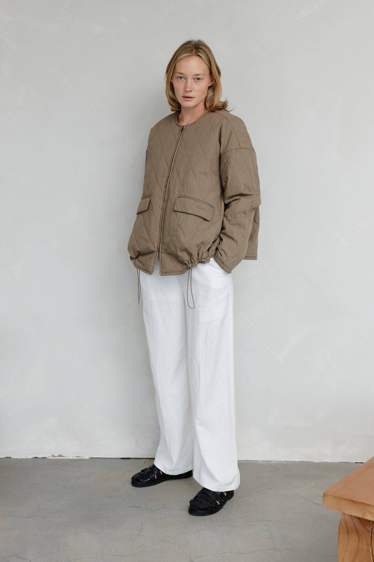 8302377369821, The Greta Jacket, Outerwear, Mod Ref, adjustable,Adjustable Cords,autumn,Black,Buttons,Casual,cf-color-cream,cf-color-olive,cf-color-white,cf-size-l,cf-size-m,cf-size-s,cf-vendor-mod-ref,Comfortable,Cream,Everyday,Fall,Front Pockets,Jacket,Layers,Long Sleeve,mens,mid-autumn,modref,new,Olive,Outerwear,Oversized,Pockets,Quilted,Quilted Jacket,Relaxed,Spring,Summer,tan,Transitional,Unisex,Warm,white,Winter,Women's,Zipper, Information Introducing The Greta Jacket - an oversized quilted jacket tha