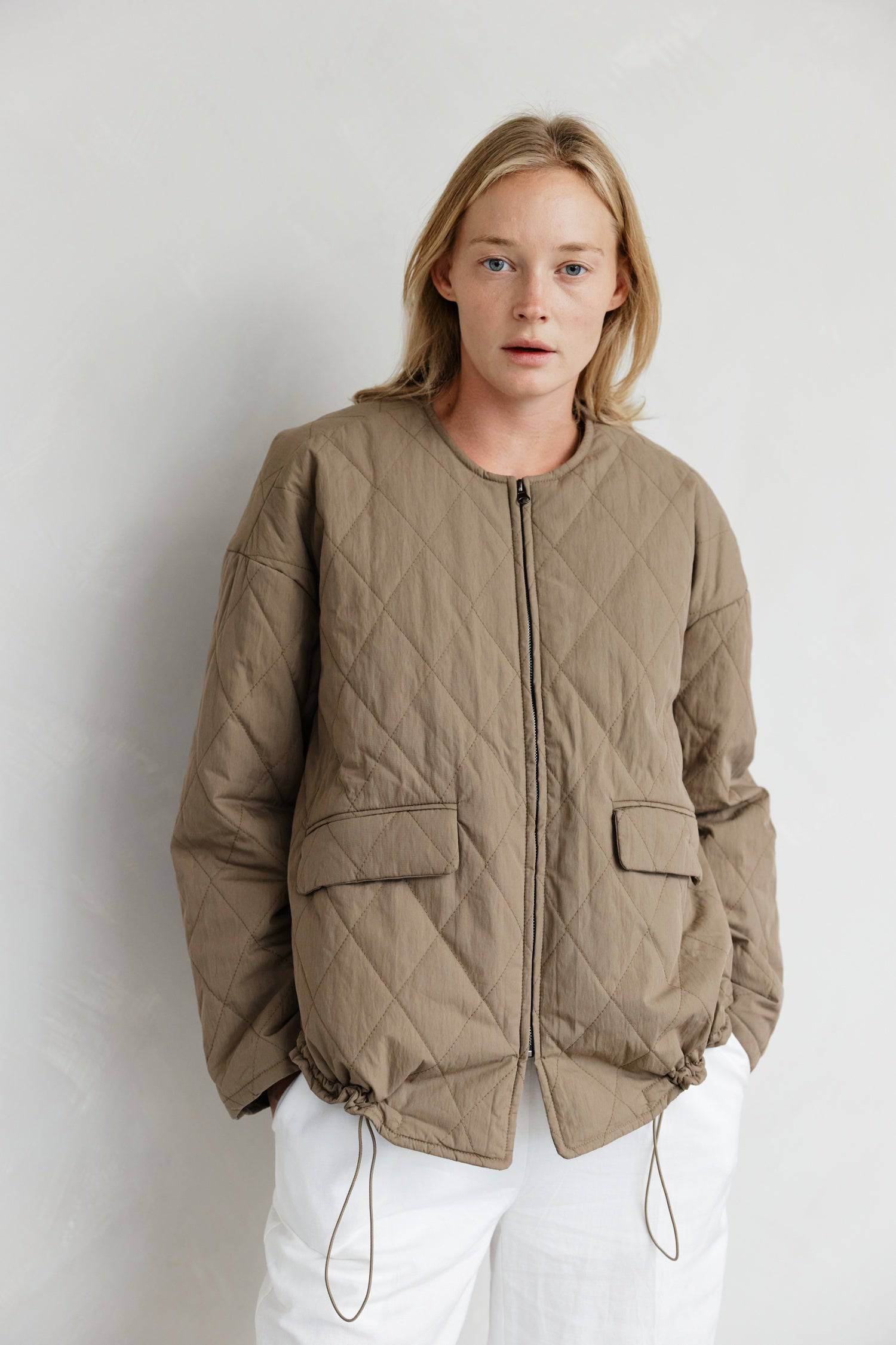 8302377369821, The Greta Jacket, Outerwear, Mod Ref, adjustable,Adjustable Cords,autumn,Black,Buttons,Casual,cf-color-cream,cf-color-olive,cf-color-white,cf-size-l,cf-size-m,cf-size-s,cf-vendor-mod-ref,Comfortable,Cream,Everyday,Fall,Front Pockets,Jacket,Layers,Long Sleeve,mens,mid-autumn,modref,new,Olive,Outerwear,Oversized,Pockets,Quilted,Quilted Jacket,Relaxed,Spring,Summer,tan,Transitional,Unisex,Warm,white,Winter,Women's,Zipper, Information Introducing The Greta Jacket - an oversized quilted jacket tha
