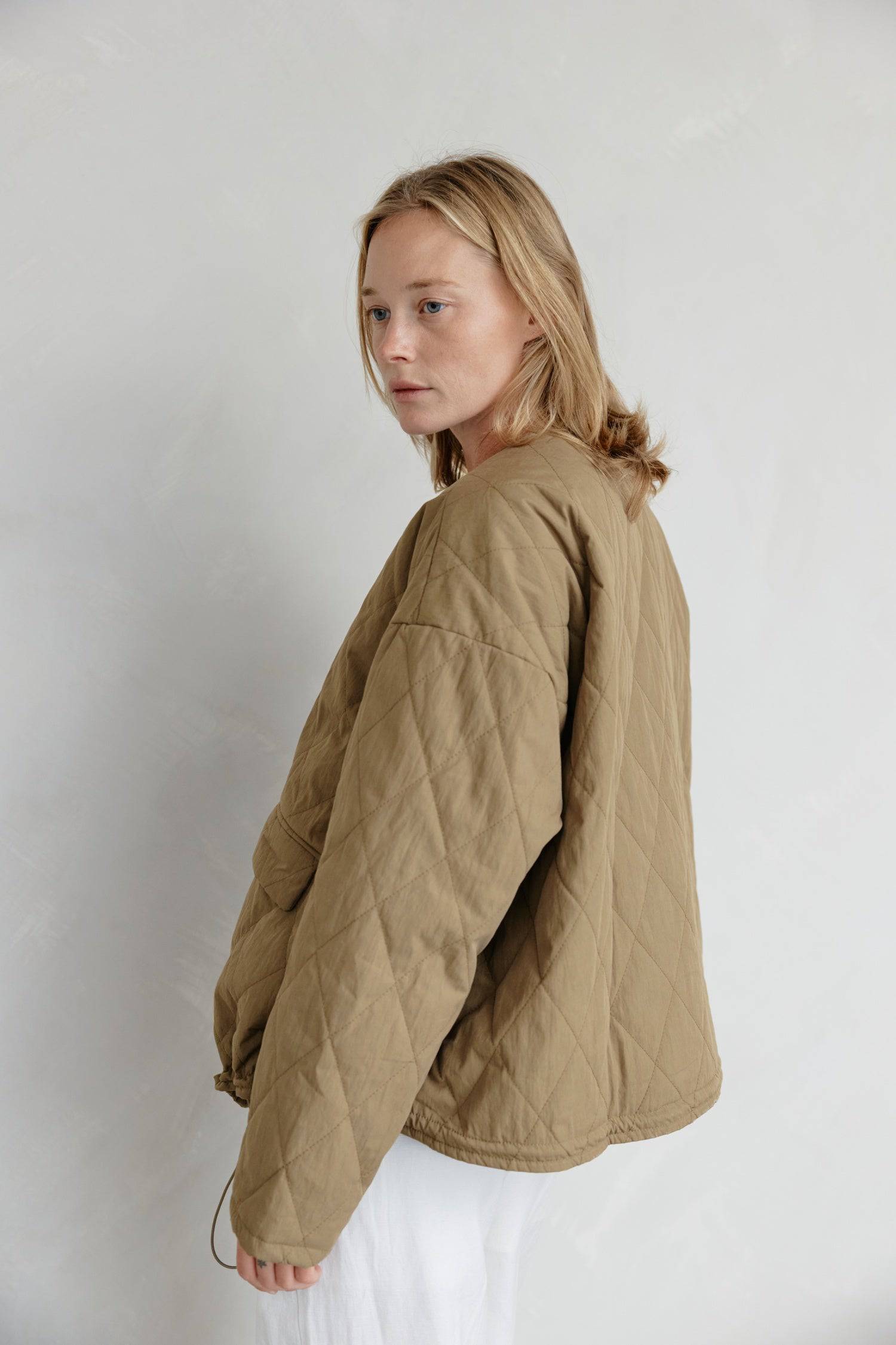 8302377369821, The Greta Jacket, Outerwear, Mod Ref, adjustable,Adjustable Cords,autumn,Black,Buttons,Casual,cf-color-cream,cf-color-olive,cf-color-white,cf-size-l,cf-size-m,cf-size-s,cf-vendor-mod-ref,Comfortable,Cream,Everyday,Fall,Front Pockets,Jacket,Layers,Long Sleeve,mens,mid-autumn,modref,new,Olive,Outerwear,Oversized,Pockets,Quilted,Quilted Jacket,Relaxed,Spring,Summer,tan,Transitional,Unisex,Warm,white,Winter,Women's,Zipper, Information Introducing The Greta Jacket - an oversized quilted jacket tha