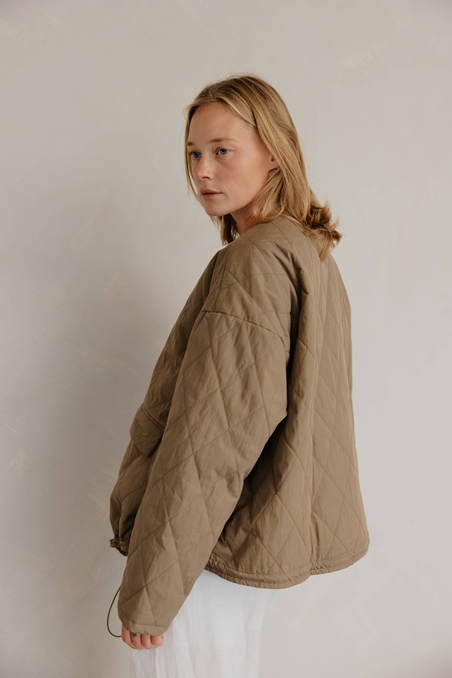 8302377369821, The Greta Jacket, Outerwear, Mod Ref, adjustable,Adjustable Cords,autumn,Black,Buttons,Casual,cf-color-cream,cf-color-olive,cf-color-white,cf-size-l,cf-size-m,cf-size-s,cf-vendor-mod-ref,Comfortable,Cream,Everyday,Fall,Front Pockets,Jacket,Layers,Long Sleeve,mens,mid-autumn,modref,new,Olive,Outerwear,Oversized,Pockets,Quilted,Quilted Jacket,Relaxed,Spring,Summer,tan,Transitional,Unisex,Warm,white,Winter,Women's,Zipper, Information Introducing The Greta Jacket - an oversized quilted jacket tha