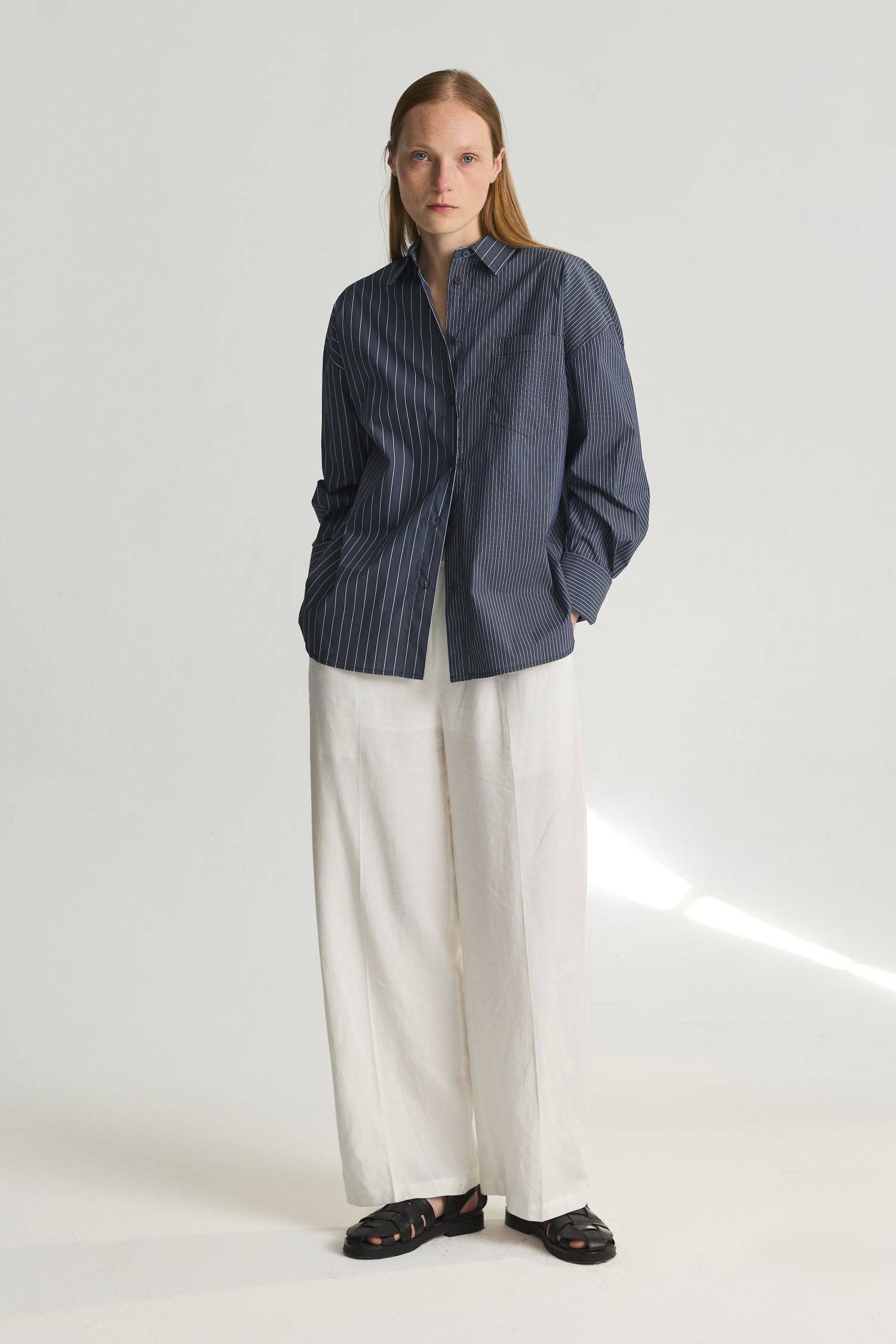 8406215131357, The Maxine Top, Tops, Mod Ref, Black,Breathable,Button down,Button Down Shirt,cf-color-dusty-blue-white,cf-color-white-black,cf-size-l,cf-size-m,cf-size-s,cf-vendor-mod-ref,Chest Pocket,Collared Top,Cotton,everyday,final-sale,finalsale,Long Sleeve,Long Sleeve Top,new,Oversized,Pinstriped,Pinstripes,Pockets,Relaxed,Relaxed Fit,sale,spring,Stripe,Striped,Stripes,Summer,Tops,Transitional,Vertical Stripes,white,womens, Information The Maxine Top is an oversized button-down shirt with a subtle mul