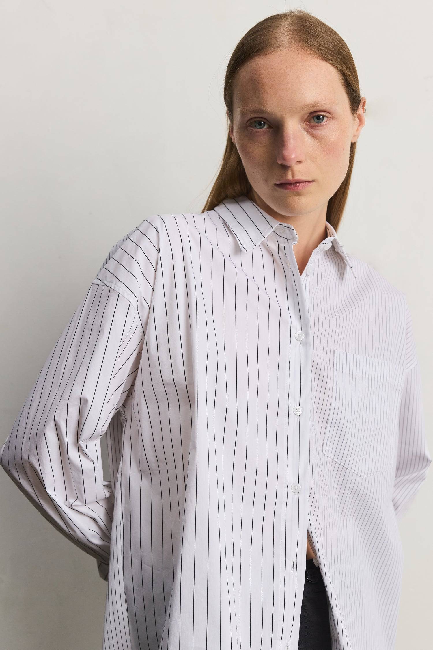 8406215131357, The Maxine Top, Tops, Mod Ref, Black,Breathable,Button down,Button Down Shirt,cf-color-dusty-blue-white,cf-color-white-black,cf-size-l,cf-size-m,cf-size-s,cf-vendor-mod-ref,Chest Pocket,Collared Top,Cotton,everyday,final-sale,finalsale,Long Sleeve,Long Sleeve Top,new,Oversized,Pinstriped,Pinstripes,Pockets,Relaxed,Relaxed Fit,sale,spring,Stripe,Striped,Stripes,Summer,Tops,Transitional,Vertical Stripes,white,womens, Information The Maxine Top is an oversized button-down shirt with a subtle mul