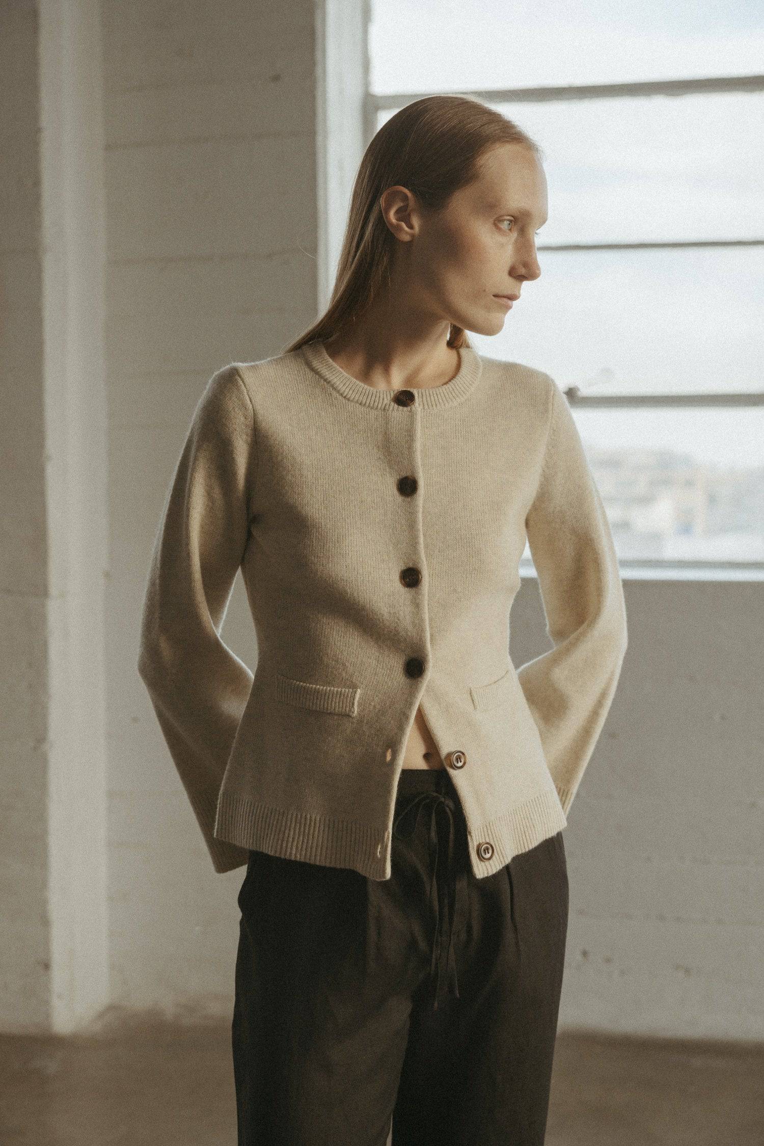 8406224437469, The Tyler Cardigan, Outerwear, Mod Ref, Acrylic,beige,bell sleeves,Black,Button up,Cardigan,Casual,cf-color-beige,cf-color-black,cf-color-oatmeal,cf-size-l,cf-size-m,cf-size-s,cf-size-xl,cf-size-xs,cf-vendor-mod-ref,Colder Seasons,Collar,collared,Cotton,fall,heavy weight,Knit,Matching Set,Mod Ref,modref,new,nylon,Oatmeal,polyester,Pullover,Rib Knit,semi-cropped,set,Sets,shawl,shawl collar,Soft Knit,tonal,Transitional,winter,Women's, Information The Tyler Cardigan features slightly flared slee