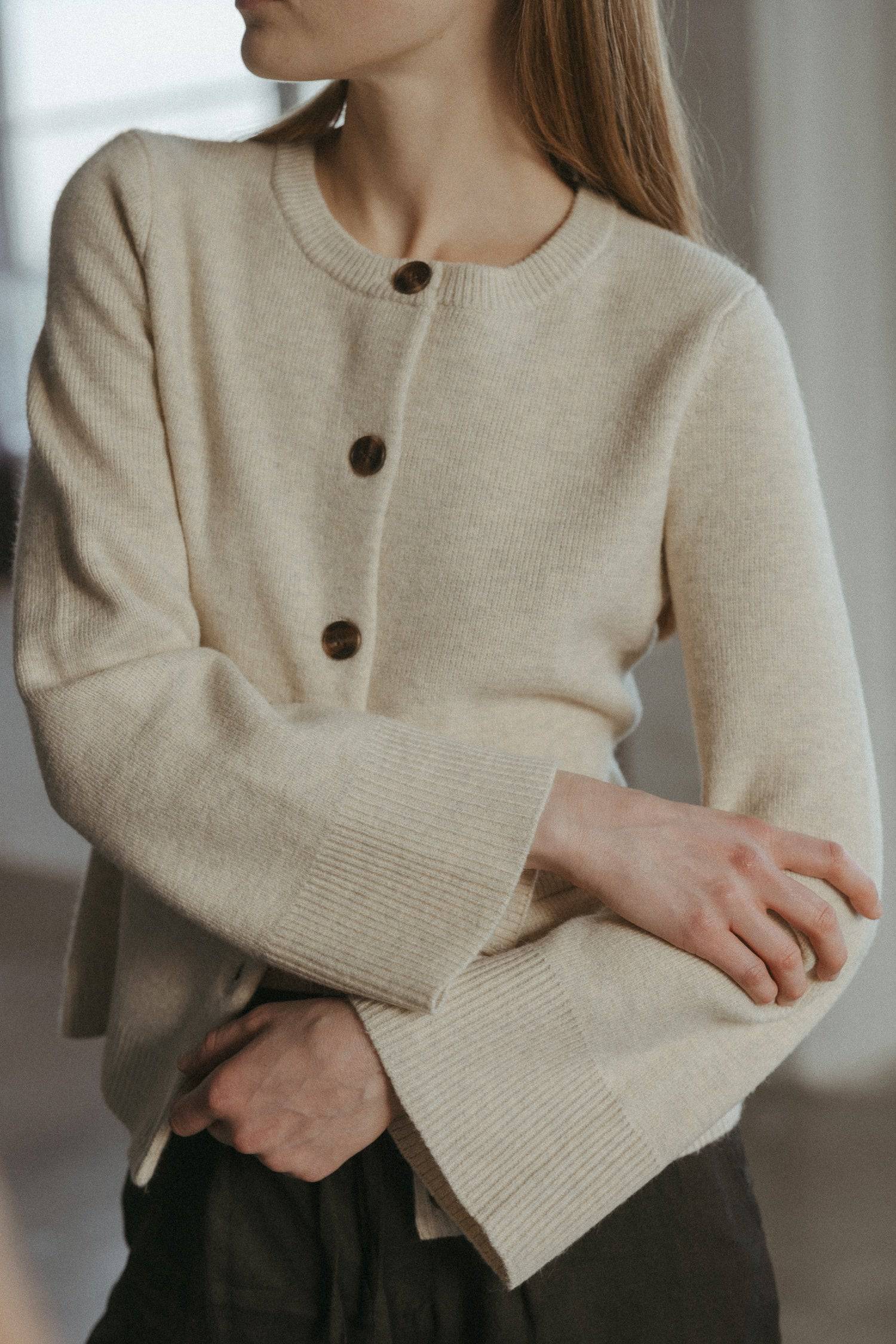 8406224437469, The Tyler Cardigan, Outerwear, Mod Ref, Acrylic,beige,bell sleeves,Black,Button up,Cardigan,Casual,cf-color-beige,cf-color-black,cf-color-oatmeal,cf-size-l,cf-size-m,cf-size-s,cf-size-xl,cf-size-xs,cf-vendor-mod-ref,Colder Seasons,Collar,collared,Cotton,fall,heavy weight,Knit,Matching Set,Mod Ref,modref,new,nylon,Oatmeal,polyester,Pullover,Rib Knit,semi-cropped,set,Sets,shawl,shawl collar,Soft Knit,tonal,Transitional,winter,Women's, Information The Tyler Cardigan features slightly flared slee