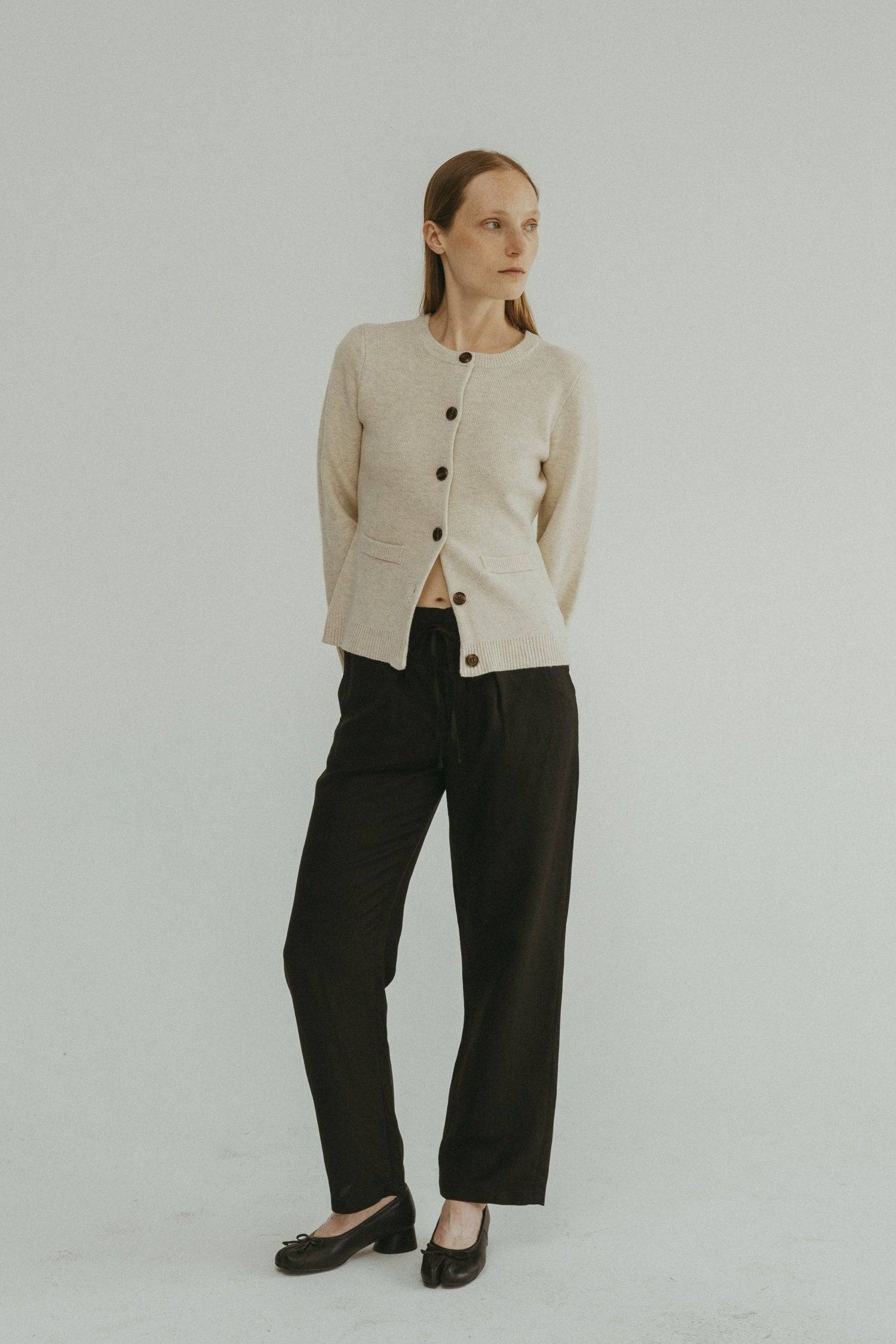 8406224437469, The Tyler Cardigan, Outerwear, Mod Ref, Acrylic,beige,bell sleeves,Black,Button up,Cardigan,Casual,cf-color-beige,cf-color-black,cf-color-oatmeal,cf-size-l,cf-size-m,cf-size-s,cf-size-xl,cf-size-xs,cf-vendor-mod-ref,Colder Seasons,Collar,collared,Cotton,fall,heavy weight,Knit,Matching Set,Mod Ref,modref,new,nylon,Oatmeal,polyester,Pullover,Rib Knit,semi-cropped,set,Sets,shawl,shawl collar,Soft Knit,tonal,Transitional,winter,Women's, Information The Tyler Cardigan features slightly flared slee