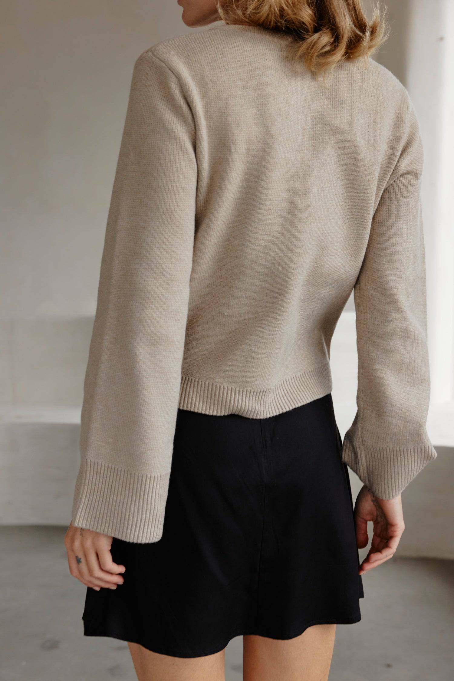 8406224437469, The Tyler Cardigan, Outerwear, Mod Ref, Acrylic,beige,bell sleeves,Black,Button up,Cardigan,Casual,cf-color-beige,cf-color-black,cf-color-oatmeal,cf-size-l,cf-size-m,cf-size-s,cf-size-xl,cf-size-xs,cf-vendor-mod-ref,Colder Seasons,Collar,collared,Cotton,fall,heavy weight,Knit,Matching Set,Mod Ref,modref,new,nylon,Oatmeal,polyester,Pullover,Rib Knit,semi-cropped,set,Sets,shawl,shawl collar,Soft Knit,tonal,Transitional,winter,Women's, Information The Tyler Cardigan features slightly flared slee