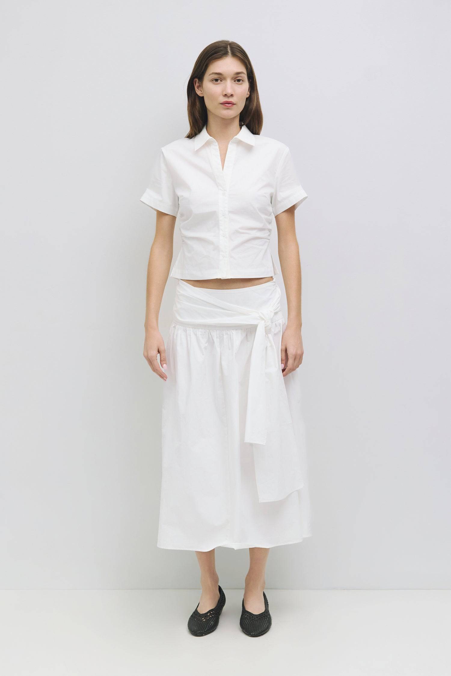 8934420775133, The Saxon Top, Tops, Mod Ref, Black,Breathable,Button down,Button Down Shirt,Button Up,Casual,cf-color-black,cf-color-blue,cf-color-white,cf-size-l,cf-size-m,cf-size-s,cf-vendor-mod-ref,cinched,Cinched Back,Cinched Waist,collared,Collared Top,Cotton,everyday,Long Sleeve,Long Sleeve Top,new,Oversized,spring,Striped,Summer,Tops,Transitional,white,womens,Work,Workwear, Information The Saxon Top is a lightweight cotton-nylon button-up shirt featuring a classic neckline and short sleeves for a cas