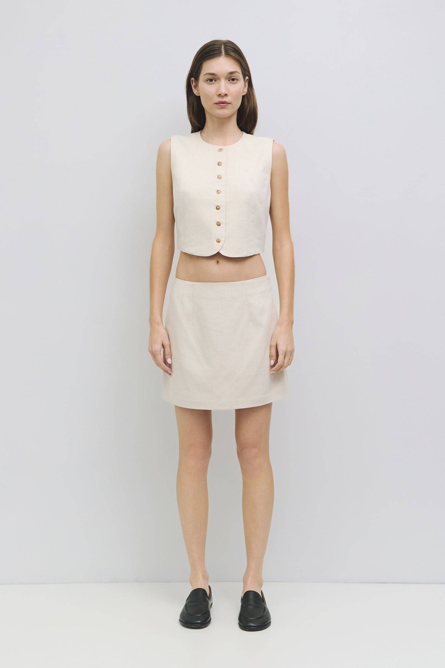 8954053918941, The Sterling Vest, Tops, Mod Ref, Black,Buttons,Casual,cf-color-black,cf-color-oatmeal,cf-size-l,cf-size-m,cf-size-s,cf-vendor-all-row,cinched,Cinched Waist,Cropped,Feminine,Matching Set,Mod Ref,new,Oatmeal,Short Sleeve,Sleeveless Top,Spring,Summer,V Neckline,Vest,Vest Top,Women's,womens top, Information The Sterling Vest is a sleeveless button-down vest with a round neckline for a polished look. With front and back princess seam details for a fitted silhouette, this fully lined top pairs bea