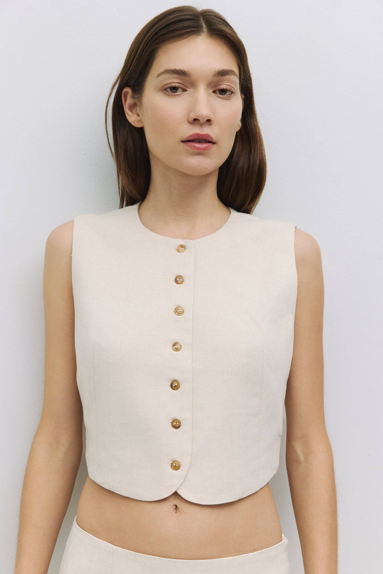 8954053918941, The Sterling Vest, Tops, Mod Ref, Black,Buttons,Casual,cf-color-black,cf-color-oatmeal,cf-size-l,cf-size-m,cf-size-s,cf-vendor-all-row,cinched,Cinched Waist,Cropped,Feminine,Matching Set,Mod Ref,new,Oatmeal,Short Sleeve,Sleeveless Top,Spring,Summer,V Neckline,Vest,Vest Top,Women's,womens top, Information The Sterling Vest is a sleeveless button-down vest with a round neckline for a polished look. With front and back princess seam details for a fitted silhouette, this fully lined top pairs bea