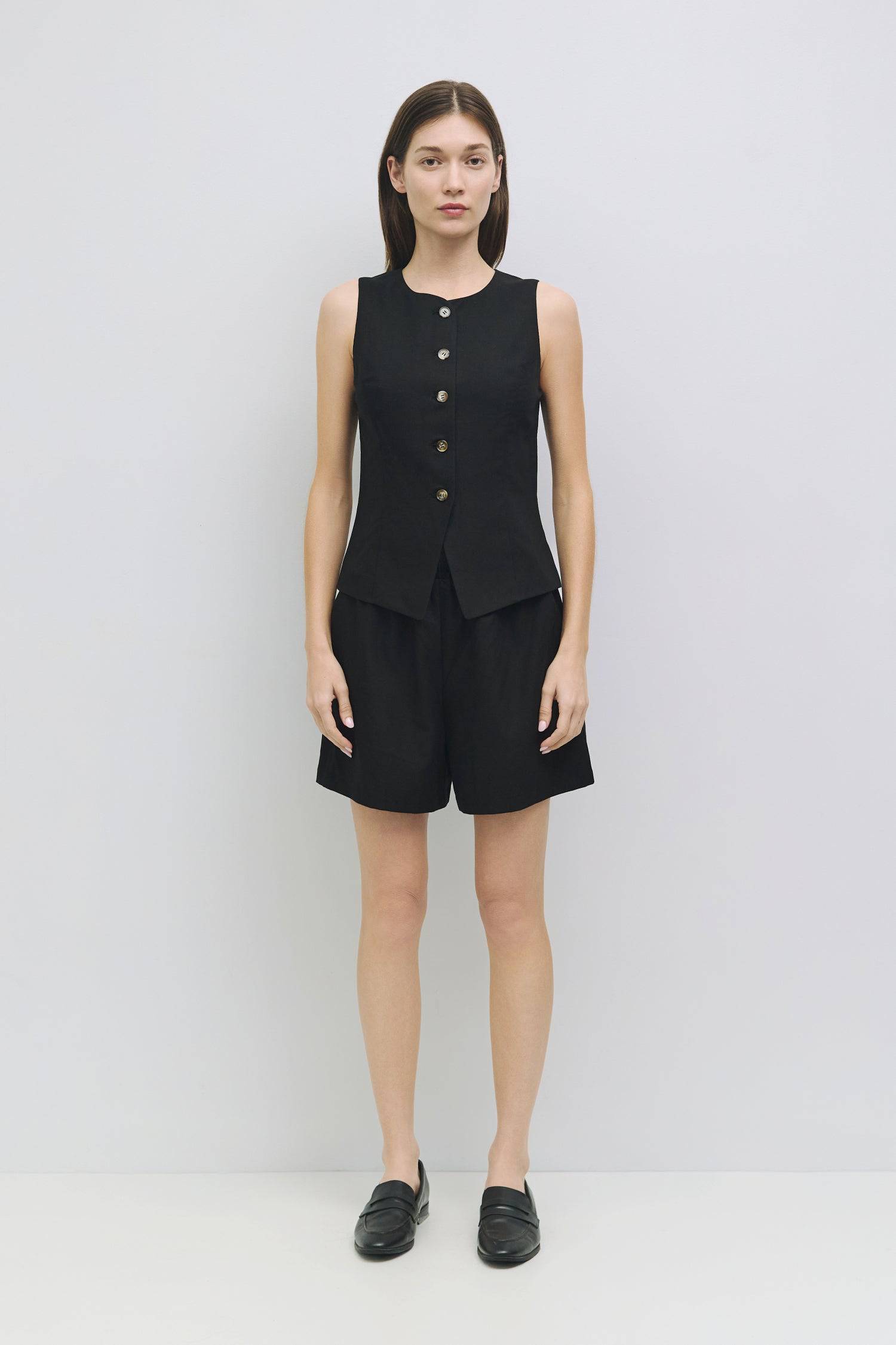 8954056736989, The Justine Top, Tops, Mod Ref, Black,Bone,Casual,cf-color-bone,cf-size-l,cf-size-m,cf-size-s,cf-size-xl,cf-vendor-all-row,Comfortable,Crew Neckline,Everyday,final-sale,finalsale,ivory,Layers,Lightweight,Minimal,new,sale,set,Sets,Sleeveless,Sleeveless Top,Soft,Spring,Top,Trendy,Vest,Vest Top,Women's, Information The Justine Top is a sleeveless high-neck vest with princess seams for a tailored fit. Fully lined, it’s great alone or paired with The Justine Shorts (PR2411) for a chic, monochromat