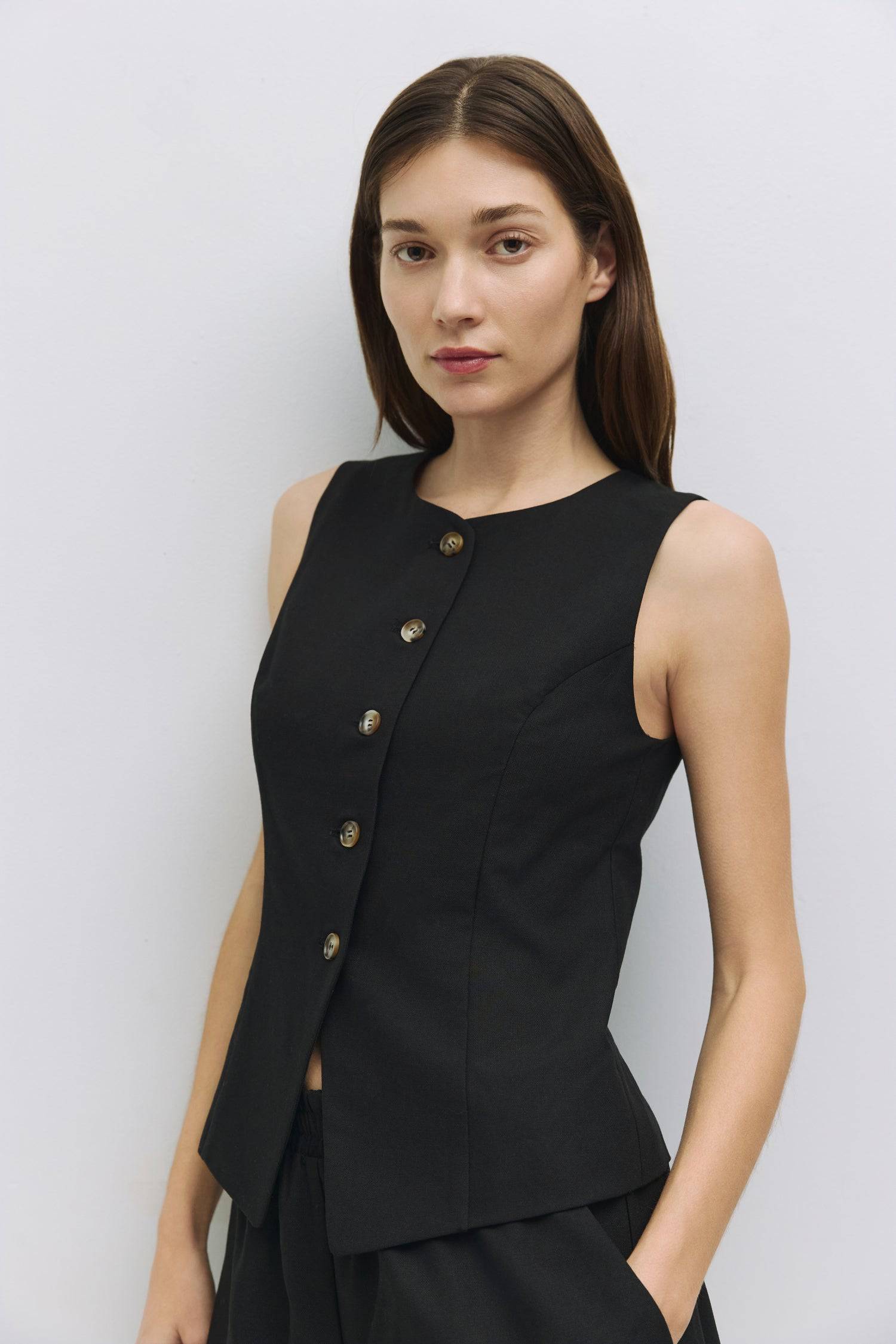 8954056736989, The Justine Top, Tops, Mod Ref, Black,Bone,Casual,cf-color-bone,cf-size-l,cf-size-m,cf-size-s,cf-size-xl,cf-vendor-all-row,Comfortable,Crew Neckline,Everyday,final-sale,finalsale,ivory,Layers,Lightweight,Minimal,new,sale,set,Sets,Sleeveless,Sleeveless Top,Soft,Spring,Top,Trendy,Vest,Vest Top,Women's, Information The Justine Top is a sleeveless high-neck vest with princess seams for a tailored fit. Fully lined, it’s great alone or paired with The Justine Shorts (PR2411) for a chic, monochromat