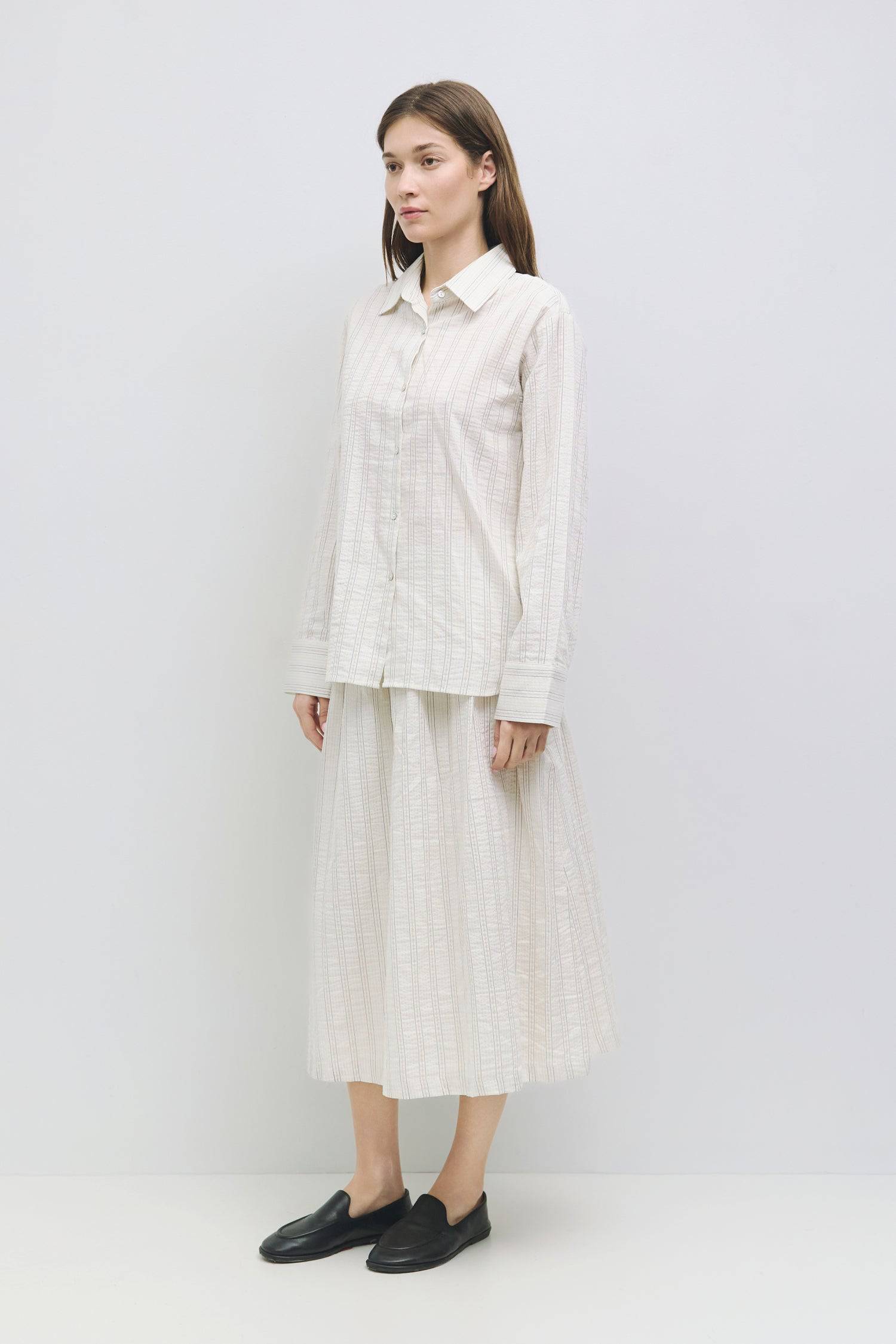 8929226064093, The Joanne Top, Tops, Mod Ref, All Row,allrow,Basics,Button down,Button Down Shirt,Casual,cf-color-blue,cf-size-l,cf-size-m,cf-size-s,cf-vendor-all-row,collared,Collared Top,Cuffed,layer,layered,layering,Layers,leightweight,Long Sleeve,Long Sleeve Shirt,Long Sleeve Top,new,Oversized,Pinstripes,spring,Striped,summer,Transitional,Women's, Information The Joanne Top is a lightweight linen-cotton button-down shirt featuring long sleeves and a classic collar neckline, designed with a striped patte