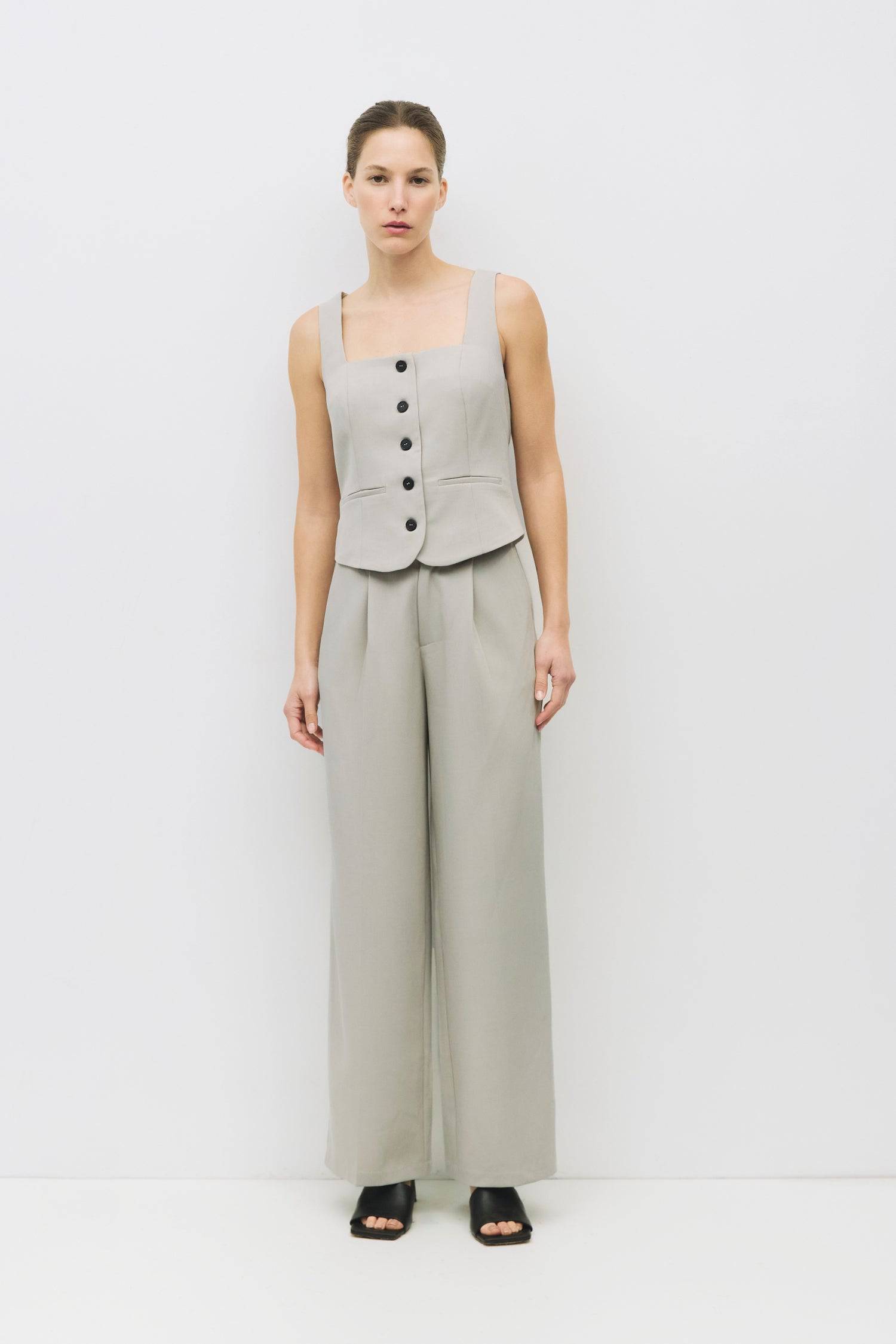 8994993275101, The Nichole Top, Tops, Mod Ref, beige,Button down,cf-color-beige,cf-color-blue,cf-size-l,cf-size-m,cf-size-s,cf-vendor-mod-ref,Cotton,everyday,new,spring,Striped,Summer,Tops,Transitional,Vest,Vest Top,womens,Work,Workwear, Information The Nichole Top is a sleeveless square-neck vest with a fitted silhouette and a sleek front button closure. Featuring two front welt pockets, it pairs perfectly with the matching Nichole Pants (PR2404) for a complete, refined look. Details Self: 95% Polyester, 5