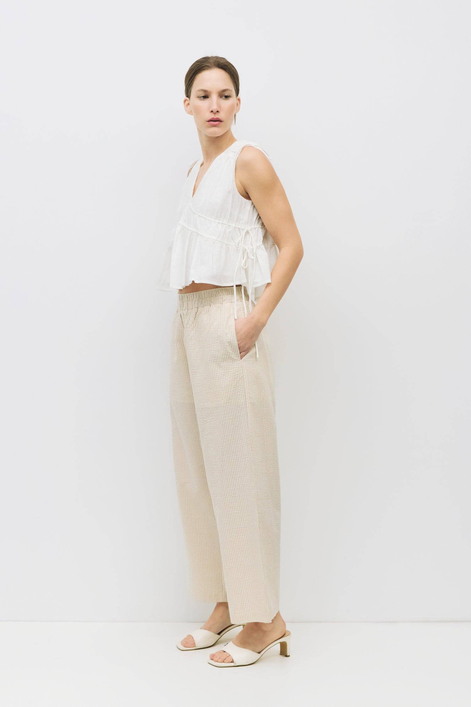 8983747625181, The Ellice Top, Tops, Mod Ref, Black,Breathable,Button down,Button Down Shirt,Button Up,Casual,cf-color-black,cf-color-blue,cf-color-white,cf-size-l,cf-size-m,cf-size-s,cf-vendor-mod-ref,cinched,Cinched Back,Cinched Waist,collared,Collared Top,Cotton,everyday,final-sale,finalsale,Long Sleeve,Long Sleeve Top,new,Oversized,sale,spring,Striped,Summer,Tops,Transitional,white,womens,Work,Workwear, Information The Ellice Top is a cropped, tiered, and sleeveless top with side adjustable ties. Featur