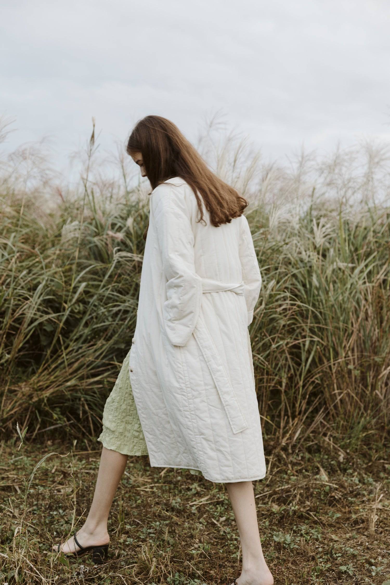 7964146401501, The Cary Coat, Outerwear, All Row, All Row,allrow,Back Detail,cf-color-black,cf-color-cream,cf-size-l,cf-size-m,cf-size-s,cf-vendor-all-row,Coat,Cotton,Cream,Detail,final-sale,finalsale,minimalist,new,Oversized,sale,statement,statement piece,tencel,Womens,womens top, Information Your winter wardrobe won't be complete without this long quilted coat. The Cary Coat is made in an oversized fit and features a classic rounded neckline, a button front closure, patch pockets, an easy below-the-knee l