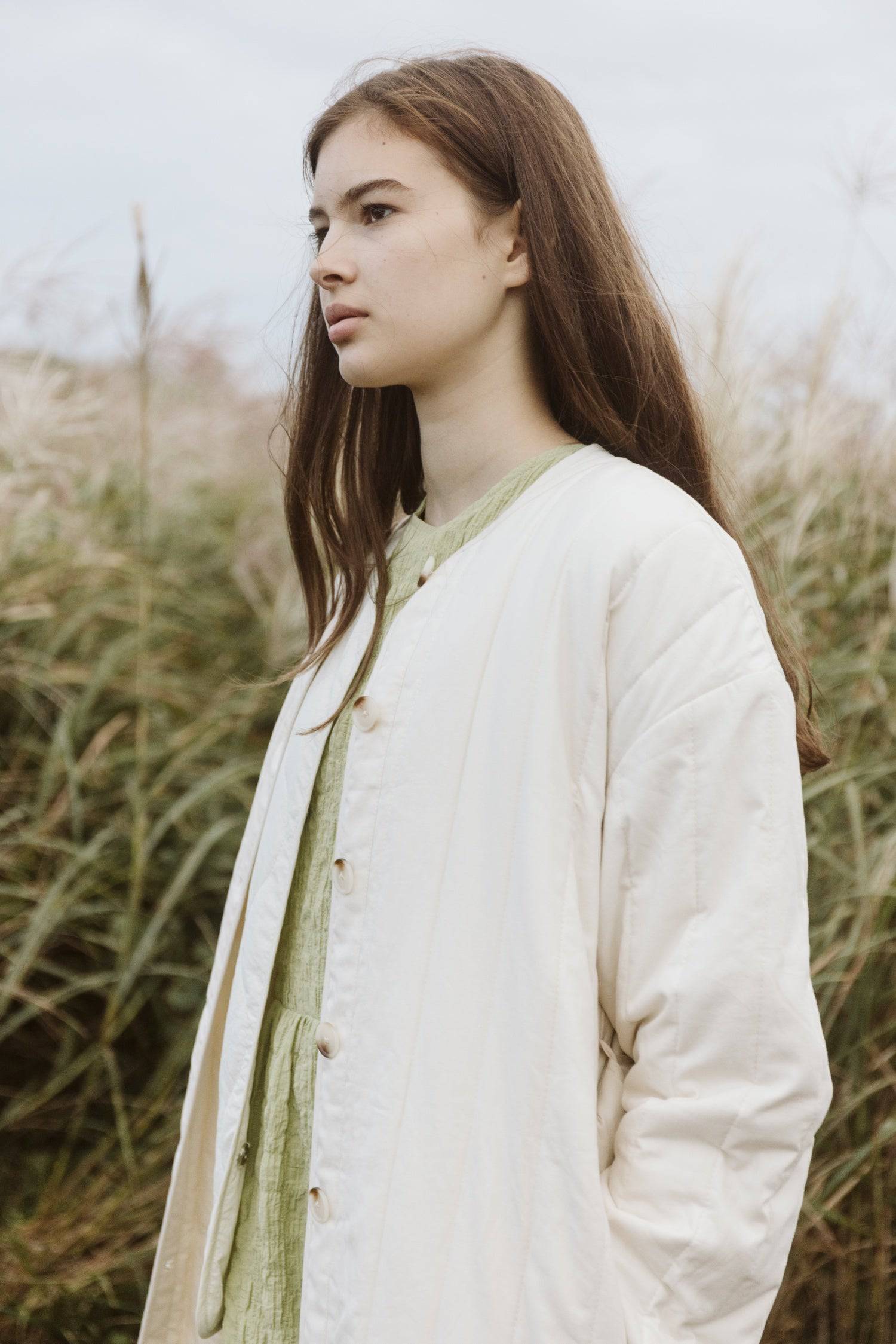 7964146401501, The Cary Coat, Outerwear, All Row, All Row,allrow,Back Detail,cf-color-black,cf-color-cream,cf-size-l,cf-size-m,cf-size-s,cf-vendor-all-row,Coat,Cotton,Cream,Detail,final-sale,finalsale,minimalist,new,Oversized,sale,statement,statement piece,tencel,Womens,womens top, Information Your winter wardrobe won't be complete without this long quilted coat. The Cary Coat is made in an oversized fit and features a classic rounded neckline, a button front closure, patch pockets, an easy below-the-knee l