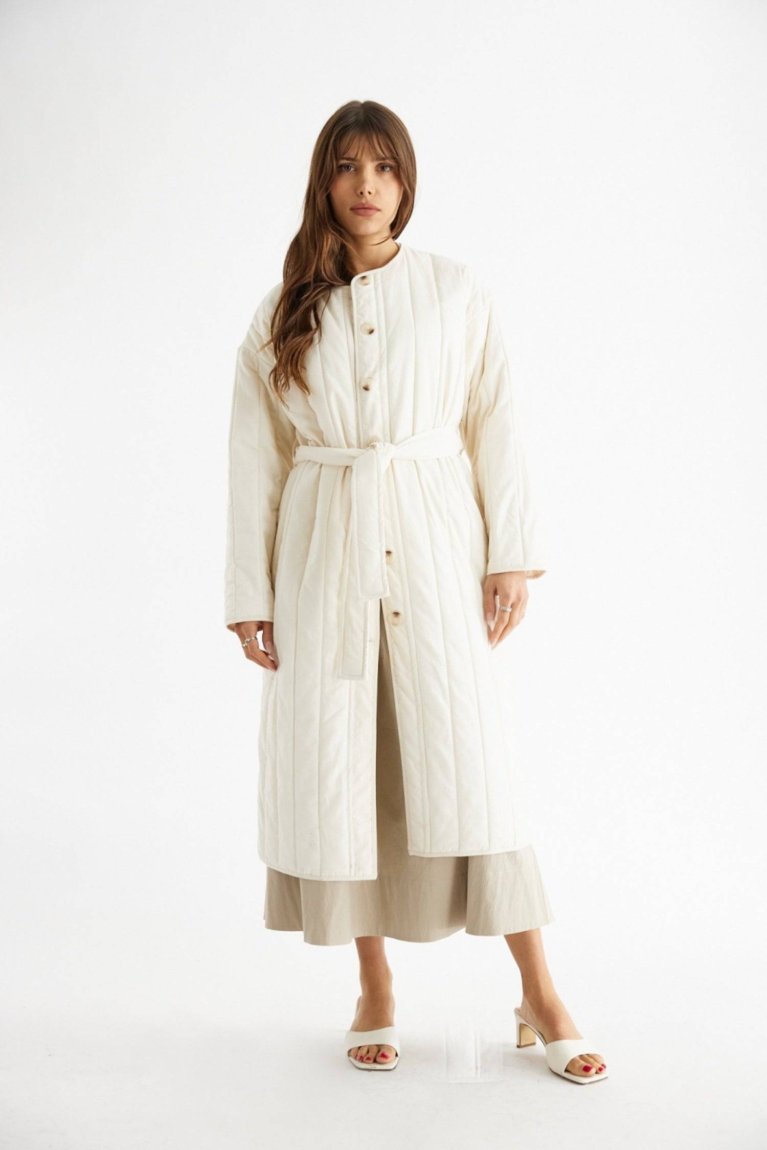 7964146401501, The Cary Coat, Outerwear, All Row, All Row,allrow,Back Detail,cf-color-black,cf-color-cream,cf-size-l,cf-size-m,cf-size-s,cf-vendor-all-row,Coat,Cotton,Cream,Detail,final-sale,finalsale,minimalist,new,Oversized,sale,statement,statement piece,tencel,Womens,womens top, Information Your winter wardrobe won't be complete without this long quilted coat. The Cary Coat is made in an oversized fit and features a classic rounded neckline, a button front closure, patch pockets, an easy below-the-knee l
