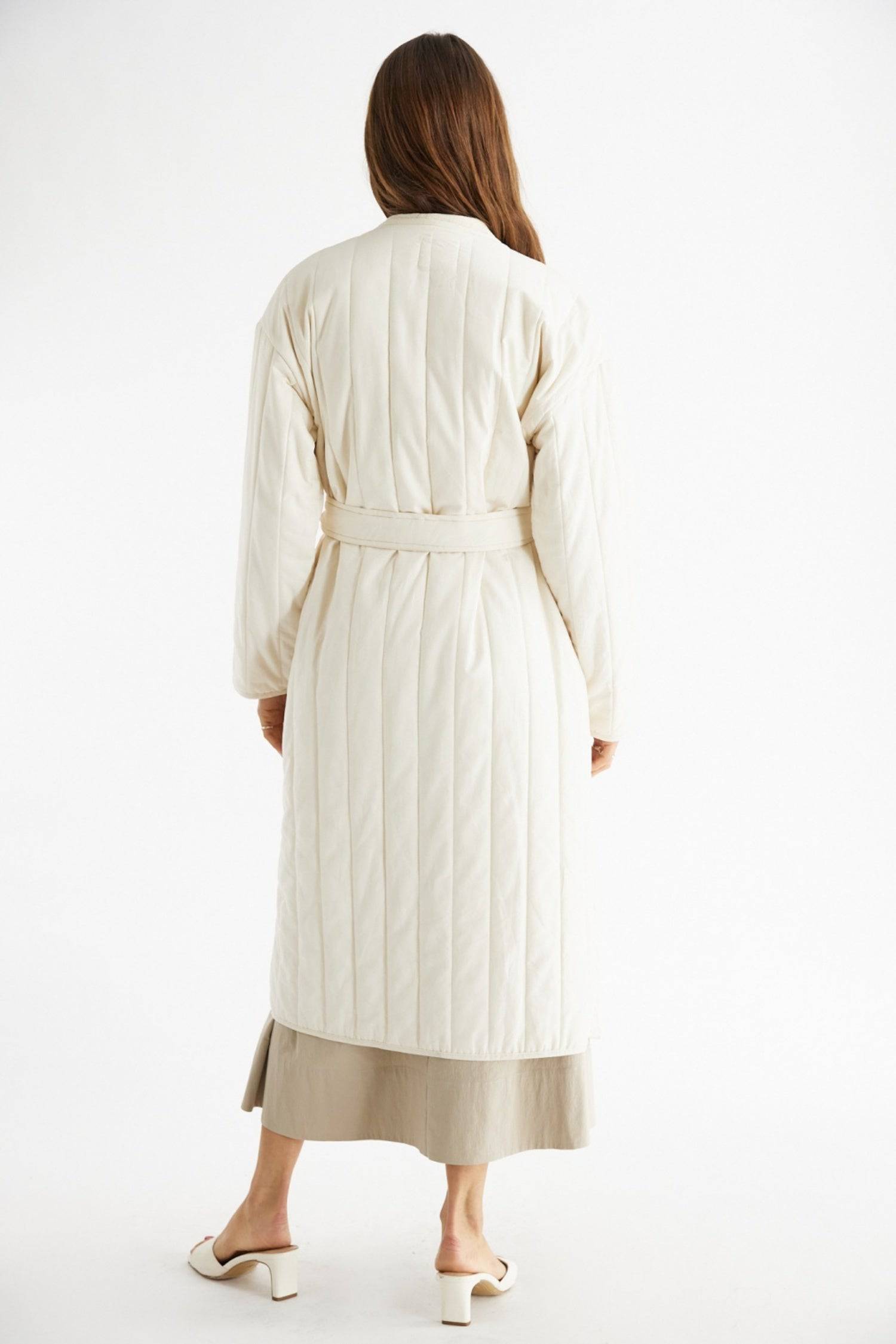 7964146401501, The Cary Coat, Outerwear, All Row, All Row,allrow,Back Detail,cf-color-black,cf-color-cream,cf-size-l,cf-size-m,cf-size-s,cf-vendor-all-row,Coat,Cotton,Cream,Detail,final-sale,finalsale,minimalist,new,Oversized,sale,statement,statement piece,tencel,Womens,womens top, Information Your winter wardrobe won't be complete without this long quilted coat. The Cary Coat is made in an oversized fit and features a classic rounded neckline, a button front closure, patch pockets, an easy below-the-knee l