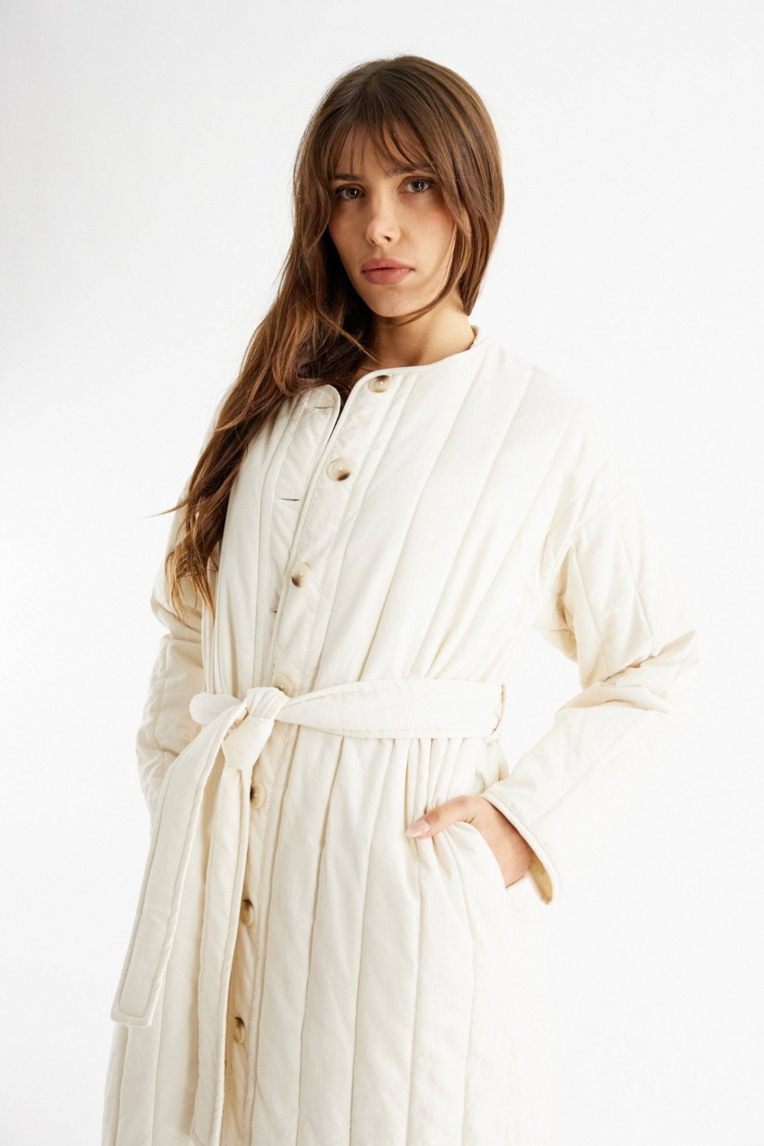 7964146401501, The Cary Coat, Outerwear, All Row, All Row,allrow,Back Detail,cf-color-black,cf-color-cream,cf-size-l,cf-size-m,cf-size-s,cf-vendor-all-row,Coat,Cotton,Cream,Detail,final-sale,finalsale,minimalist,new,Oversized,sale,statement,statement piece,tencel,Womens,womens top, Information Your winter wardrobe won't be complete without this long quilted coat. The Cary Coat is made in an oversized fit and features a classic rounded neckline, a button front closure, patch pockets, an easy below-the-knee l