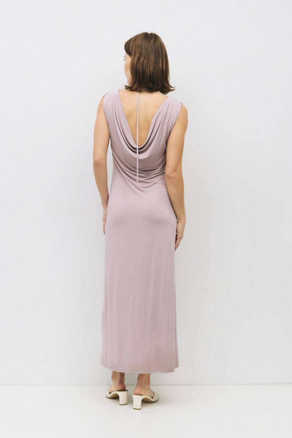 8982639444189, The Benson Dress, Dress, Mod Ref, Black,Casual,cf-color-black,cf-color-red,cf-color-white,cf-size-l,cf-vendor-all-row,collared,Comfort,Comfortable,Feminine,full skirt,Midi,Midi Dress,midi length,new,Red,Sleeveless,Sleeveless Dress,Spring,versatile,white,Womens, Information The Benson Dress is a sleeveless, fitted maxi dress made from a buttery soft modal blend, featuring a wide neck and a flattering slight flare at the bottom hem. With a stunning cowl back detail and adjustable self-tie strap