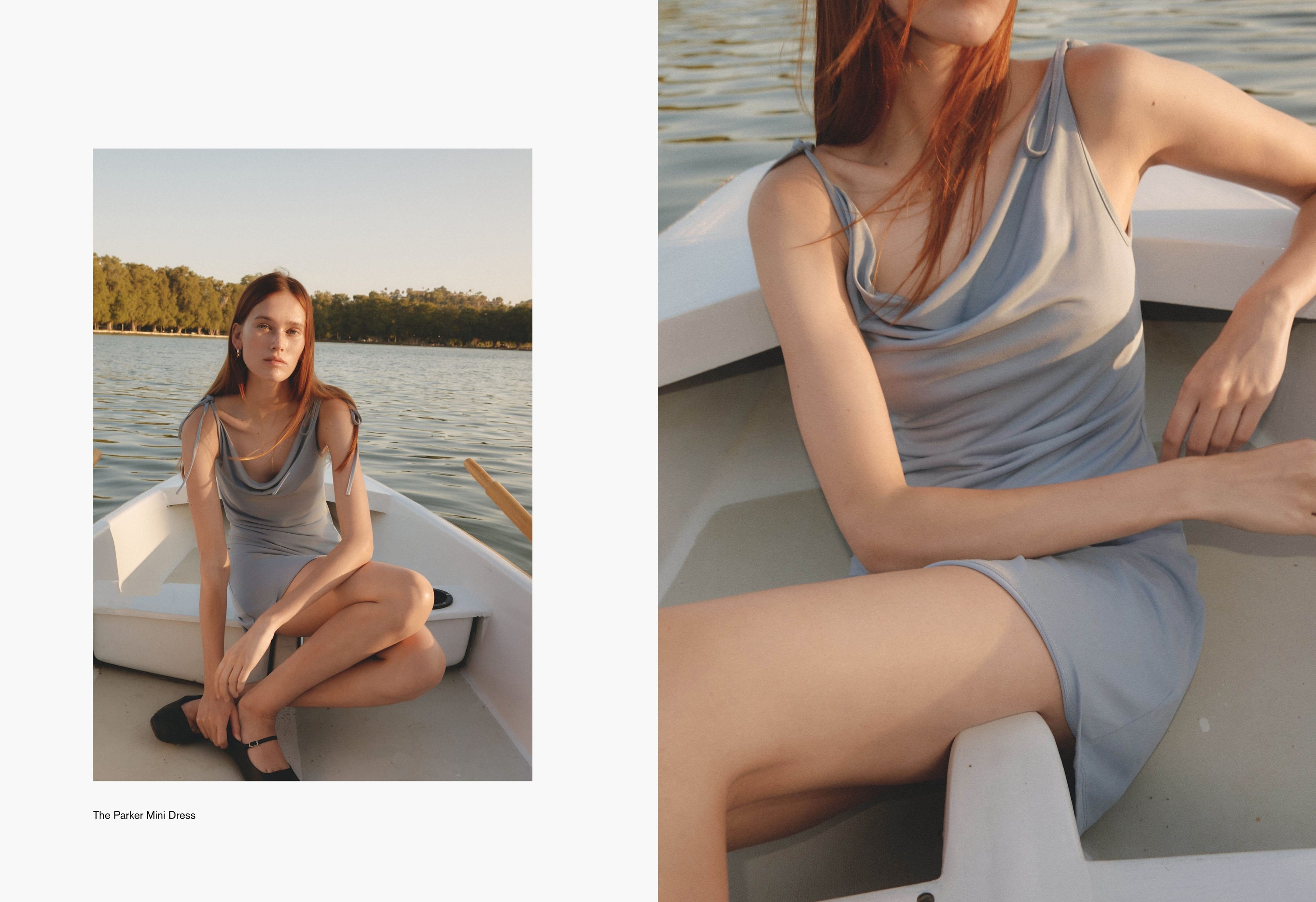 Woman seated casually in a white boat wearing a light blue ribbed dress. Her expression is soft and unposed, capturing a candid summer moment.