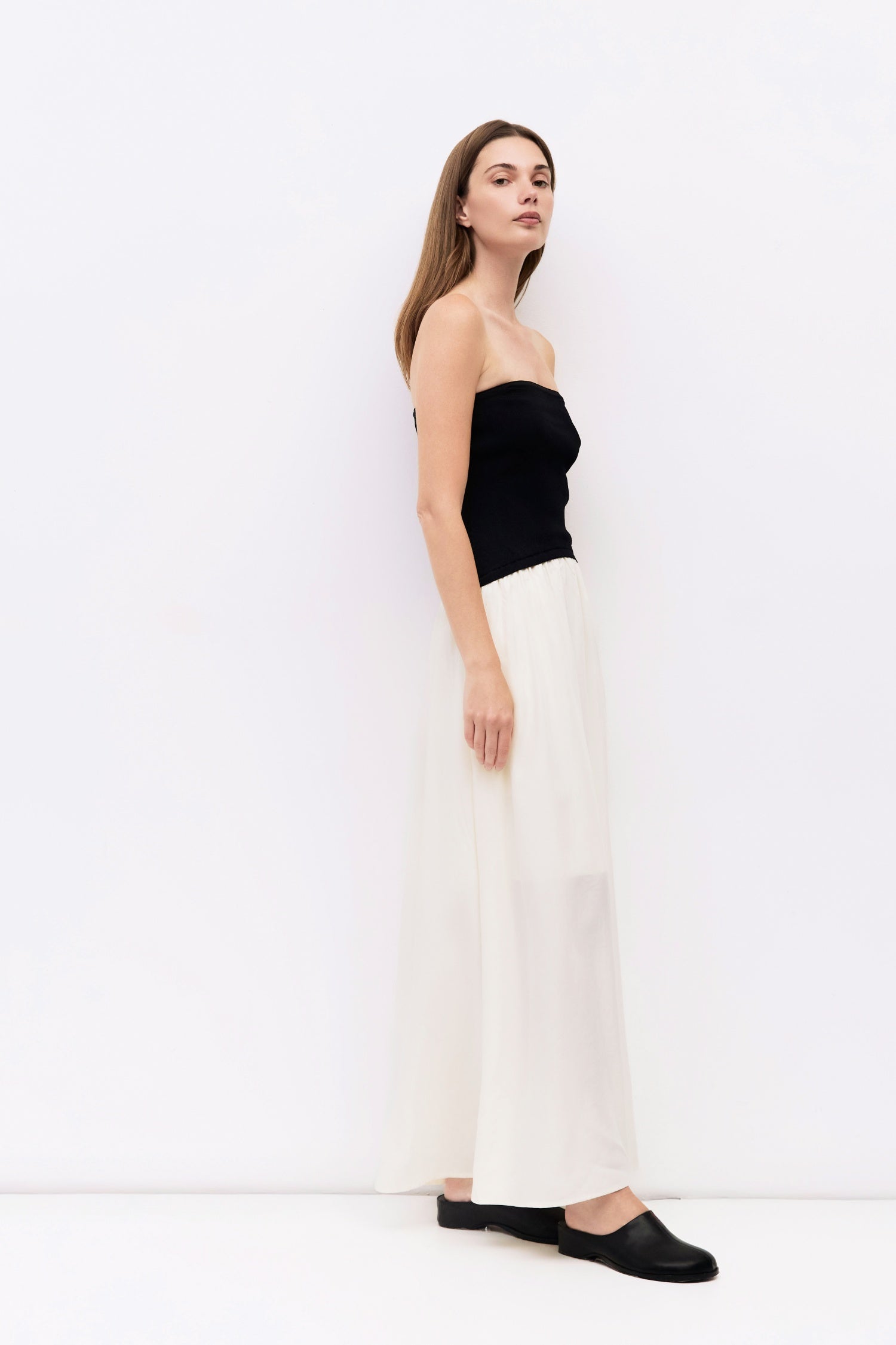 9061529747677, The Stefani Dress, Dress, All Row, cf-size-l,cf-vendor-all-row,collared,Comfort,Comfortable,Feminine,merrow edge,mini,new,Spring,strapless,Summer,textured,Textured Fabric,Transitional,versatile,Womens, Information The Stefani Dress pairs a fitted, strapless knit bodice with a lightweight, shirred midi skirt for a flattering two-tone silhouette. Side pockets add a practical touch to this effortlessly chic piece. Details Self: 100% Recycled Polyester, Contrast: 65% Viscose, 35% Nylon Strapless 