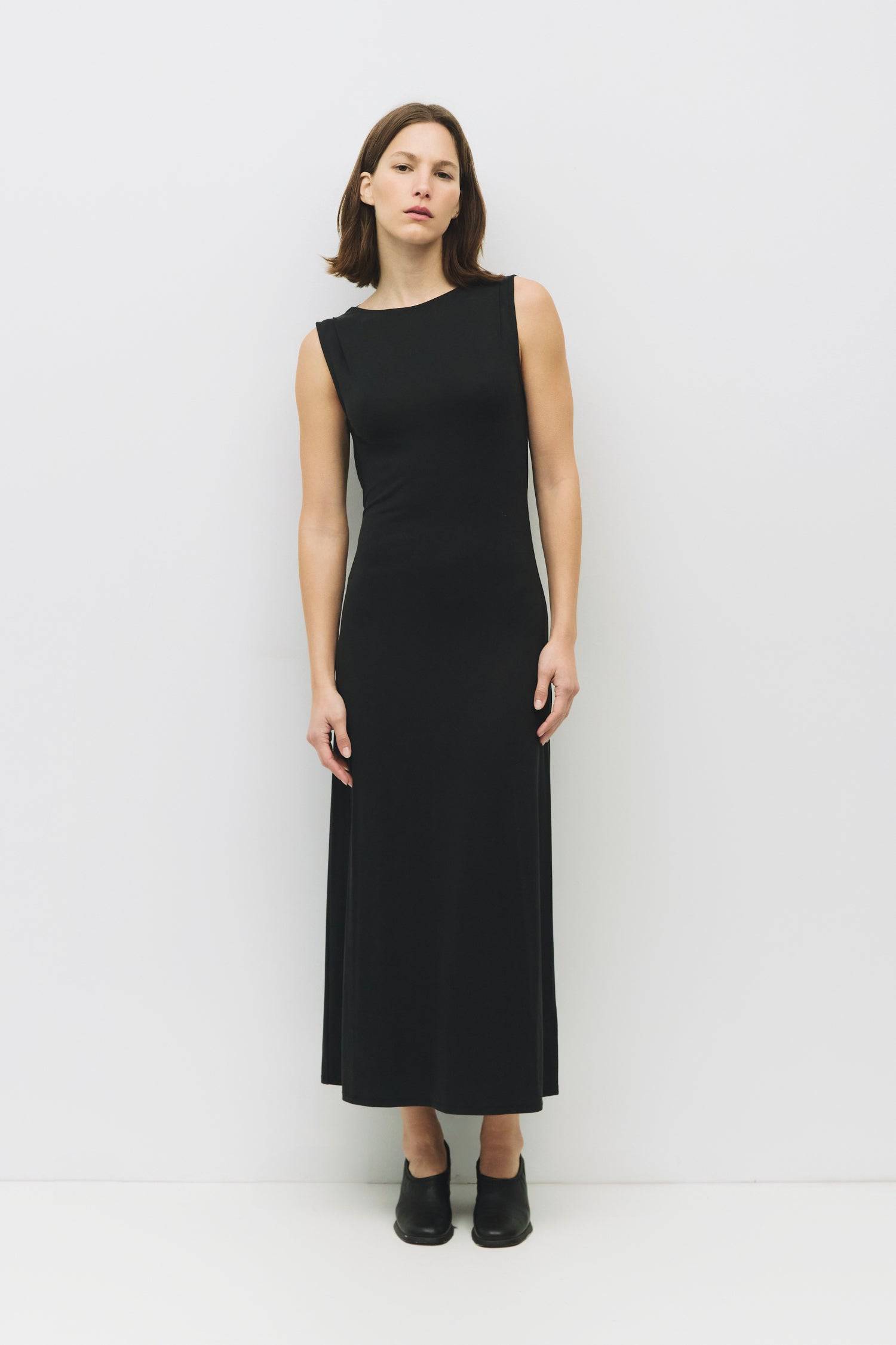 8982639444189, The Benson Dress, Dress, Mod Ref, Black,Casual,cf-color-black,cf-color-red,cf-color-white,cf-size-l,cf-vendor-all-row,collared,Comfort,Comfortable,Feminine,full skirt,Midi,Midi Dress,midi length,new,Red,Sleeveless,Sleeveless Dress,Spring,versatile,white,Womens, Information The Benson Dress is a sleeveless, fitted maxi dress made from a buttery soft modal blend, featuring a wide neck and a flattering slight flare at the bottom hem. With a stunning cowl back detail and adjustable self-tie strap