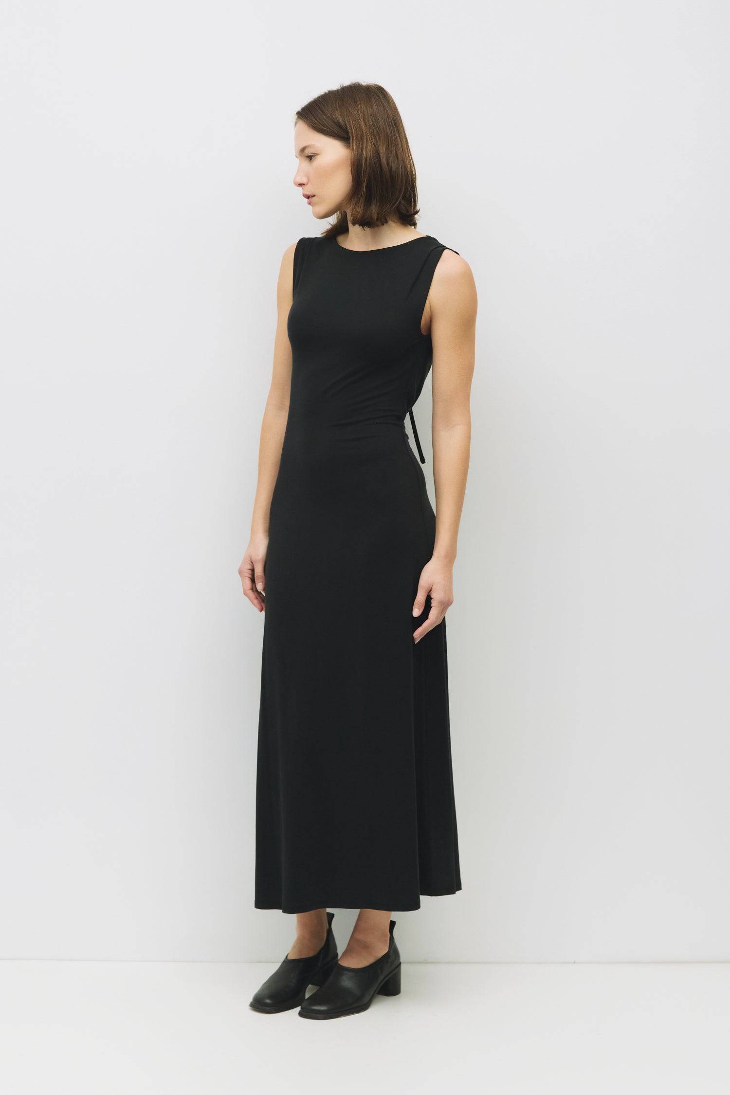 8982639444189, The Benson Dress, Dress, Mod Ref, Black,Casual,cf-color-black,cf-color-red,cf-color-white,cf-size-l,cf-vendor-all-row,collared,Comfort,Comfortable,Feminine,full skirt,Midi,Midi Dress,midi length,new,Red,Sleeveless,Sleeveless Dress,Spring,versatile,white,Womens, Information The Benson Dress is a sleeveless, fitted maxi dress made from a buttery soft modal blend, featuring a wide neck and a flattering slight flare at the bottom hem. With a stunning cowl back detail and adjustable self-tie strap