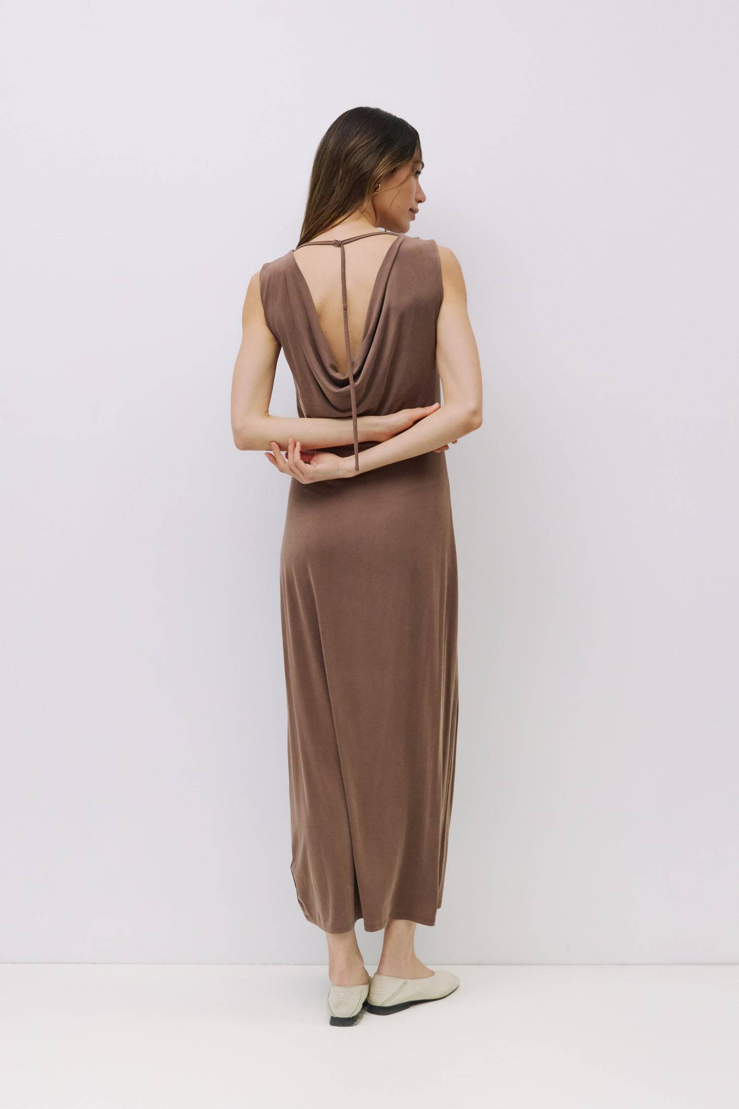 8982639444189, The Benson Dress, Dress, Mod Ref, Black,Casual,cf-color-black,cf-color-red,cf-color-white,cf-size-l,cf-vendor-all-row,collared,Comfort,Comfortable,Feminine,full skirt,Midi,Midi Dress,midi length,new,Red,Sleeveless,Sleeveless Dress,Spring,versatile,white,Womens, Information The Benson Dress is a sleeveless, fitted maxi dress made from a buttery soft modal blend, featuring a wide neck and a flattering slight flare at the bottom hem. With a stunning cowl back detail and adjustable self-tie strap