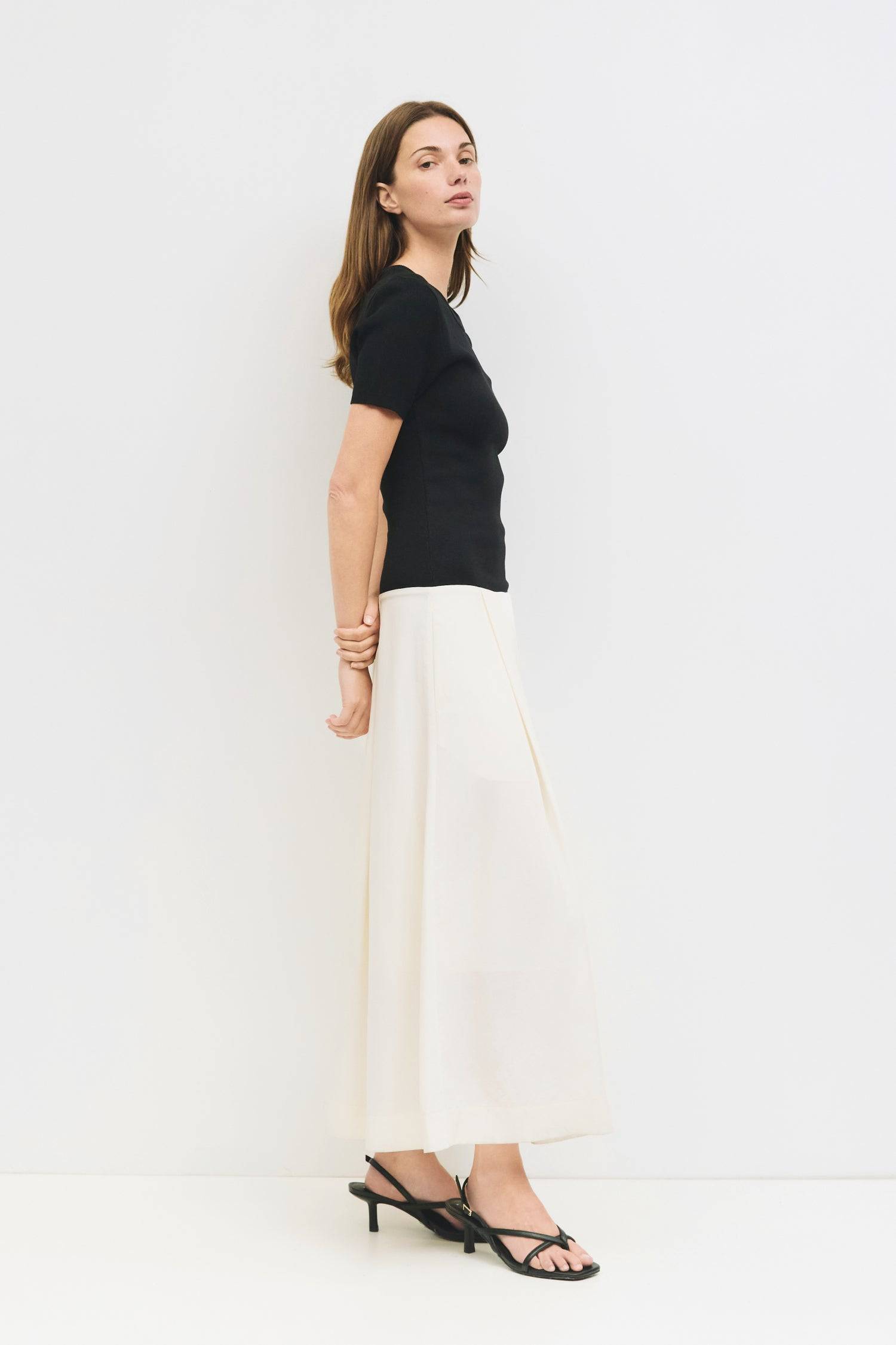 9065342173405, The Geena Dress, Dress, Mod Ref, Black,Casual,cf-color-black,cf-color-khaki,cf-color-white,cf-size-l,cf-size-m,cf-size-s,cf-vendor-mod-ref,Cinched Waist,Color Block,Comfortable,corset,Dress,dressy,Form Fitting,Long Dress,maxi dress,Mid Length Dress,Midi,Midi Dress,midi length,new,Pleated,pleated skirt,pleating,Pleats,Pocket,Pockets,Relaxed Fit,side pockets,Spring,square,Summer,white,womens, Information The Geena Dress features a crew neck and short sleeves with a form-fitting knit top that fl