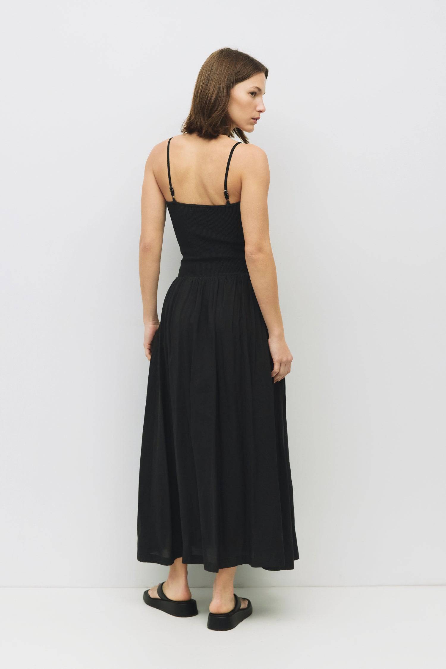 8983746511069, The Hudson Dress, Dress, Mod Ref, Black,Casual,cf-color-black,cf-color-red,cf-color-white,cf-size-l,cf-vendor-all-row,collared,Comfort,Comfortable,Feminine,full skirt,Midi,Midi Dress,midi length,new,Red,Sleeveless,Sleeveless Dress,Spring,versatile,white,Womens, Information The Hudson Dress is a flattering midi tube dress with a ribbed knit top and adjustable straps. The fully lined woven skirt adds a touch of sophistication, making it a go-to piece that transitions seamlessly from day to nigh