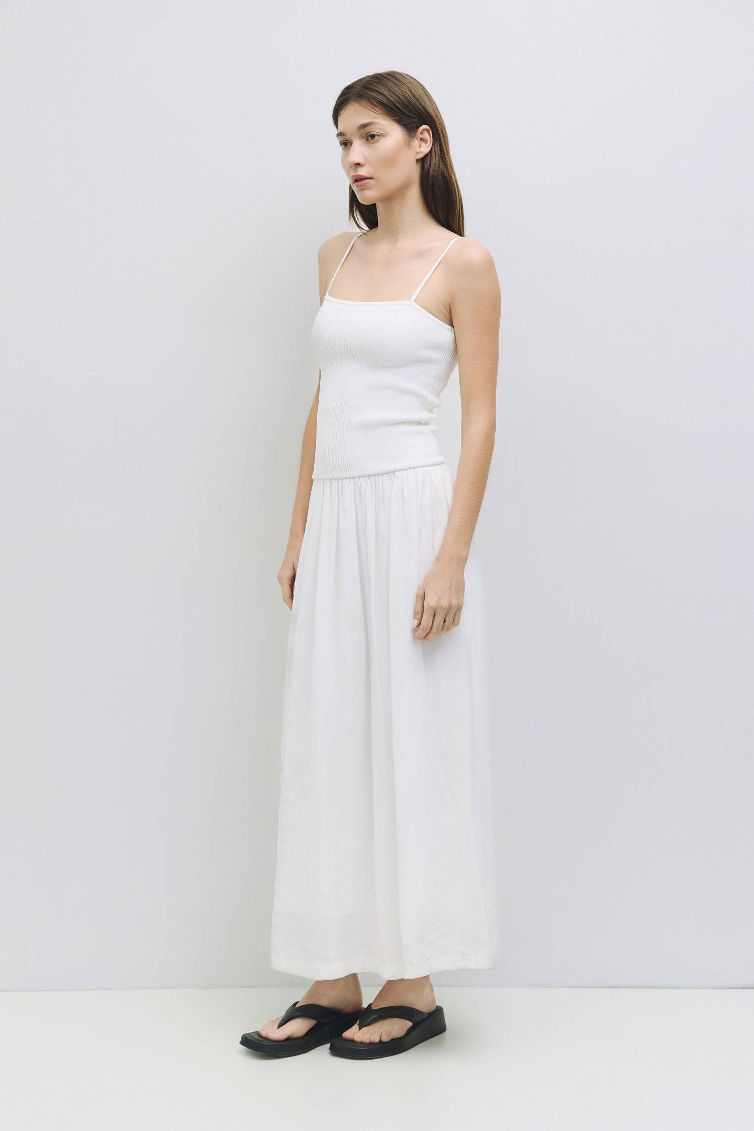 8983746511069, The Hudson Dress, Dress, Mod Ref, Black,Casual,cf-color-black,cf-color-red,cf-color-white,cf-size-l,cf-vendor-all-row,collared,Comfort,Comfortable,Feminine,full skirt,Midi,Midi Dress,midi length,new,Red,Sleeveless,Sleeveless Dress,Spring,versatile,white,Womens, Information The Hudson Dress is a flattering midi tube dress with a ribbed knit top and adjustable straps. The fully lined woven skirt adds a touch of sophistication, making it a go-to piece that transitions seamlessly from day to nigh