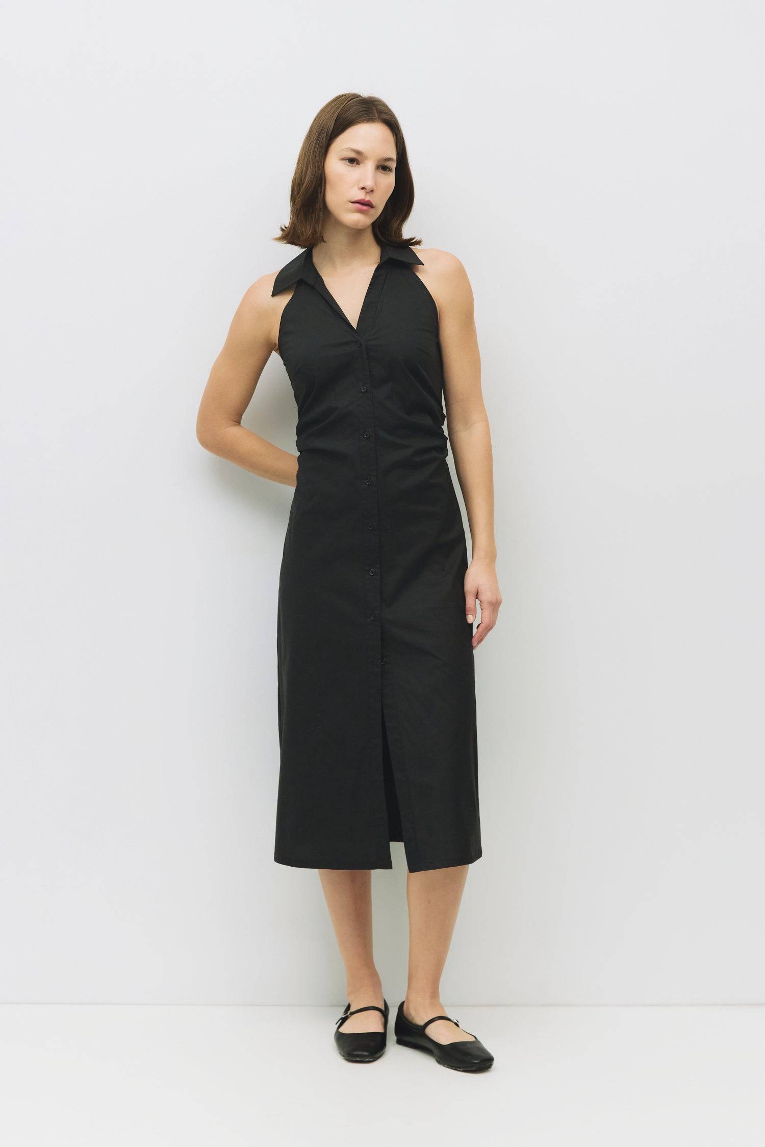 8983745003741, The Cambria Dress, Dress, Mod Ref, Black,Casual,cf-color-black,cf-color-red,cf-color-white,cf-size-l,cf-vendor-all-row,collared,Comfort,Comfortable,Feminine,full skirt,Midi,Midi Dress,midi length,new,Red,Sleeveless,Sleeveless Dress,Spring,versatile,white,Womens, Information The Cambria Dress is a sleeveless, midi-length poplin dress featuring a halter neckline with a collar and a front button placket. With adjustable lace-back ties, it offers a customizable fit and effortless style for warm-w